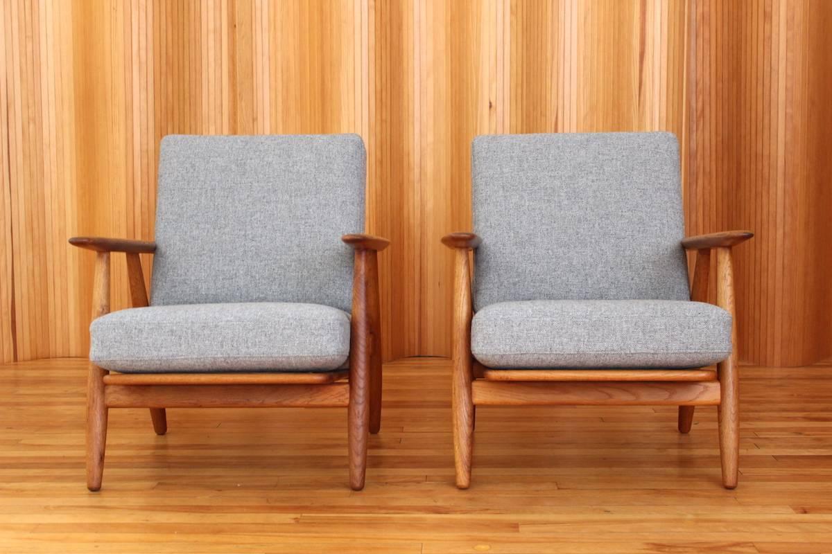 Description: Pair of oak 'Cigar' lounge chairs, model no. GE-240. 

Designer: Hans J Wegner

Manufacturer: Getama, Denmark

Date: 1955

Dimensions: Width 68cm; depth 78cm; height 75cm

Condition: Excellent, vintage condition. The solid oak