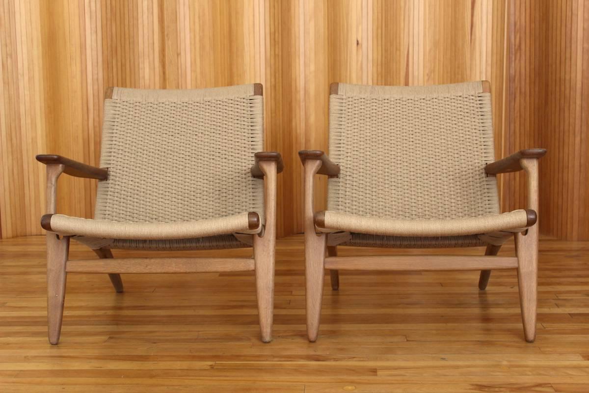 Description: Pair of oak lounge chair, model no. CH25

Designer: Hans J Wegner

Manufacturer: Carl Hansen & Son, Odense, Denmark.

Date: 1950

Dimensions: Width 75cm; depth 70cm; height 72cm

Condition: Excellent, vintage condition. The