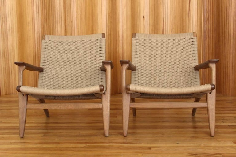 Description: Pair of oak lounge chair, model no. CH25

Designer: Hans J Wegner

Manufacturer: Carl Hansen & Son, Odense, Denmark.

Date: 1950

Dimensions: Width 75cm; depth 70cm; height 72cm

Condition: Excellent, vintage condition. The
