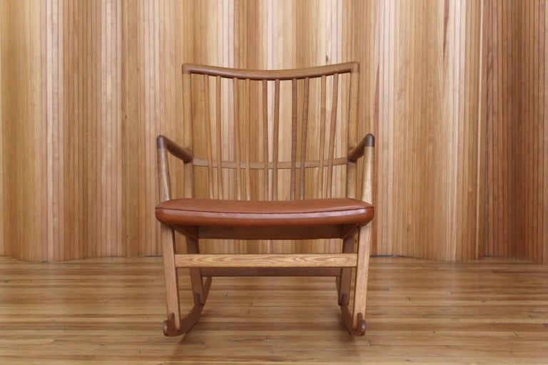 Description: Oak rocking chair, model no. ML33. 

Designer: Hans J Wegner

Manufacturer: Mikael Laursen, Denmark

Date: 1942.

Dimensions: Width 62 cm; depth 75 cm; height 81 cm.

Condition: Excellent, vintage condition. The solid oak