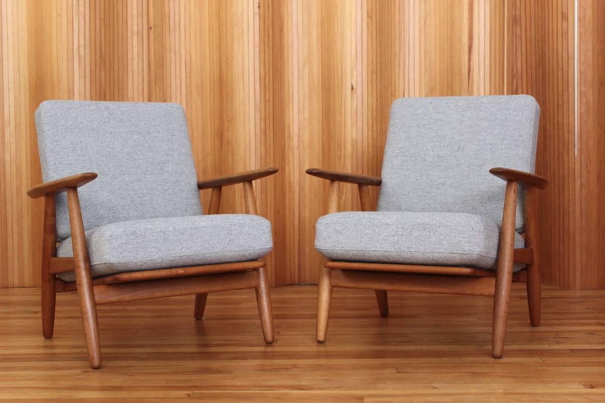 Description: Pair of oak 'Cigar' lounge chairs, model no. GE-240. 

Designer: Hans J Wegner

Manufacturer: GETAMA, Denmark

Date: 1955

Dimensions: width 68 cm; depth 78 cm; height 75 cm.

Condition: Excellent, vintage condition. The solid