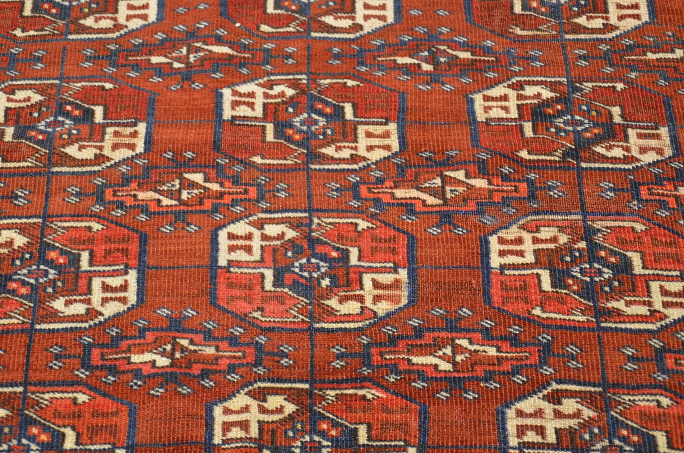 Typical carpet from Western Turkestan design of "Guls" typical of this manufacture and colorful in burgundy wine.
