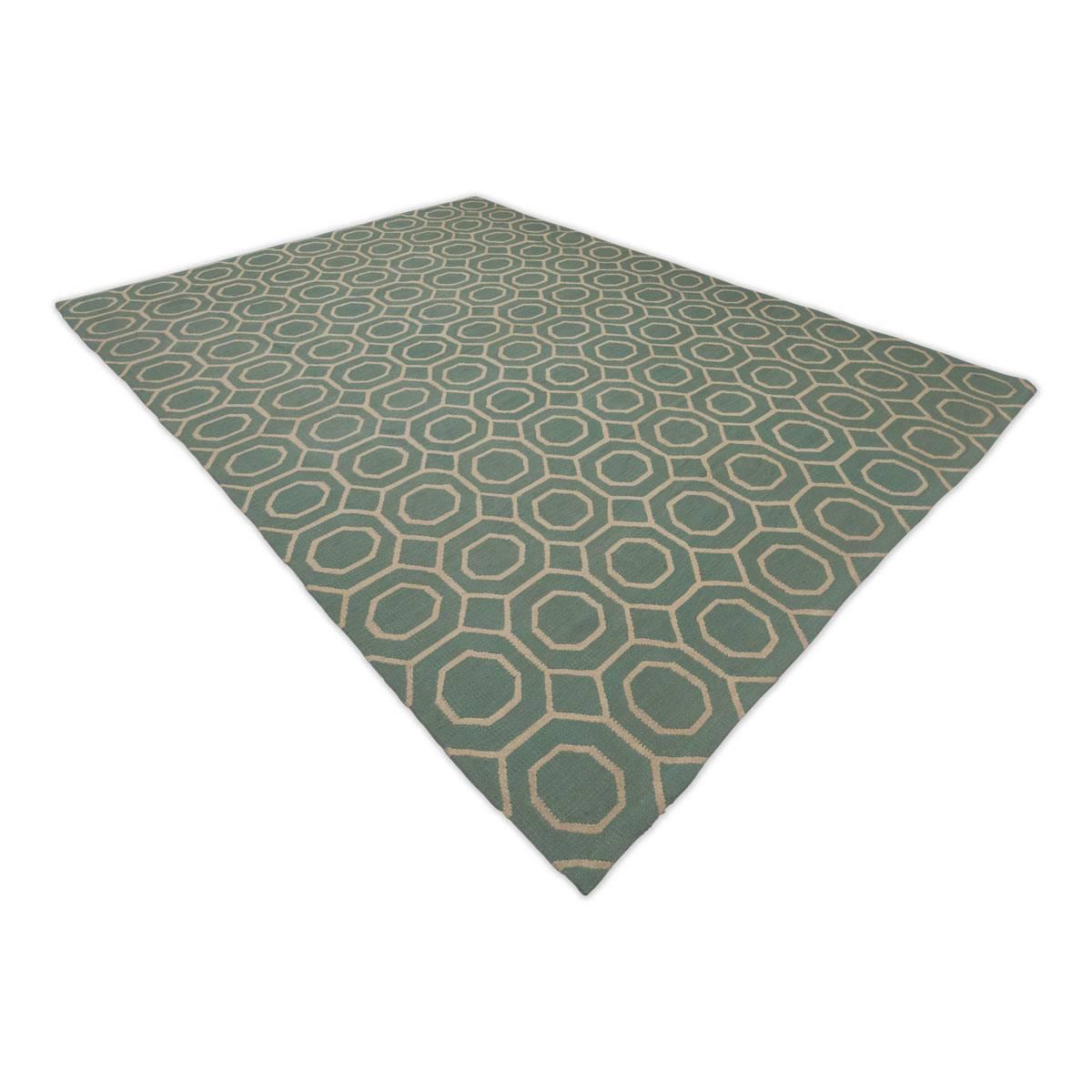 Wool Flatweave Rug with Geometric Desig over Green Background.