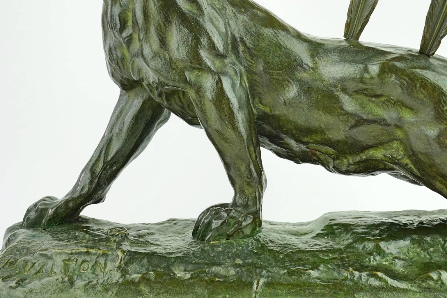 Like the Assyrian reliefs of wounded lions of the British Museum, this wounded lioness with two arrows in its back is full of drama.

The famous French sculptor Charles Valton (1851-1918) specialized in big cats taken from life at the Jardin des