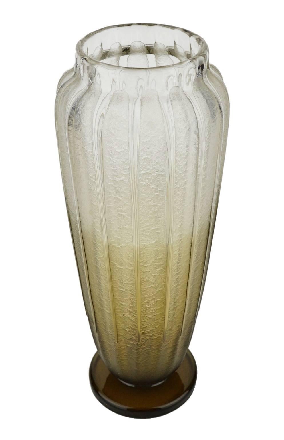 French Art Deco vase signed Schneider on a piedouche from the collection “A côtes”. Smoked glass with frosted effect through acid.

From 1919 on, Charles Schneider kept strictly separated the two brands of his company. The more artistic, varied and