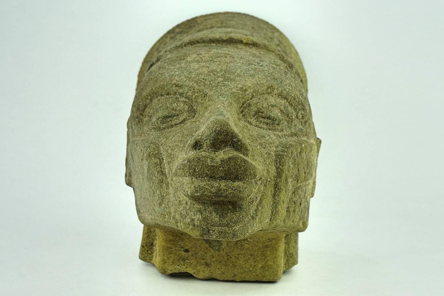 Female Mangbetu (African, Congolese) head with elaborated hairstyle. In the style of Francois Bazin (1897-1956).

The Mangbetu tribe used to deform the head of its élite members from childhood, producing especially elongated heads that remind