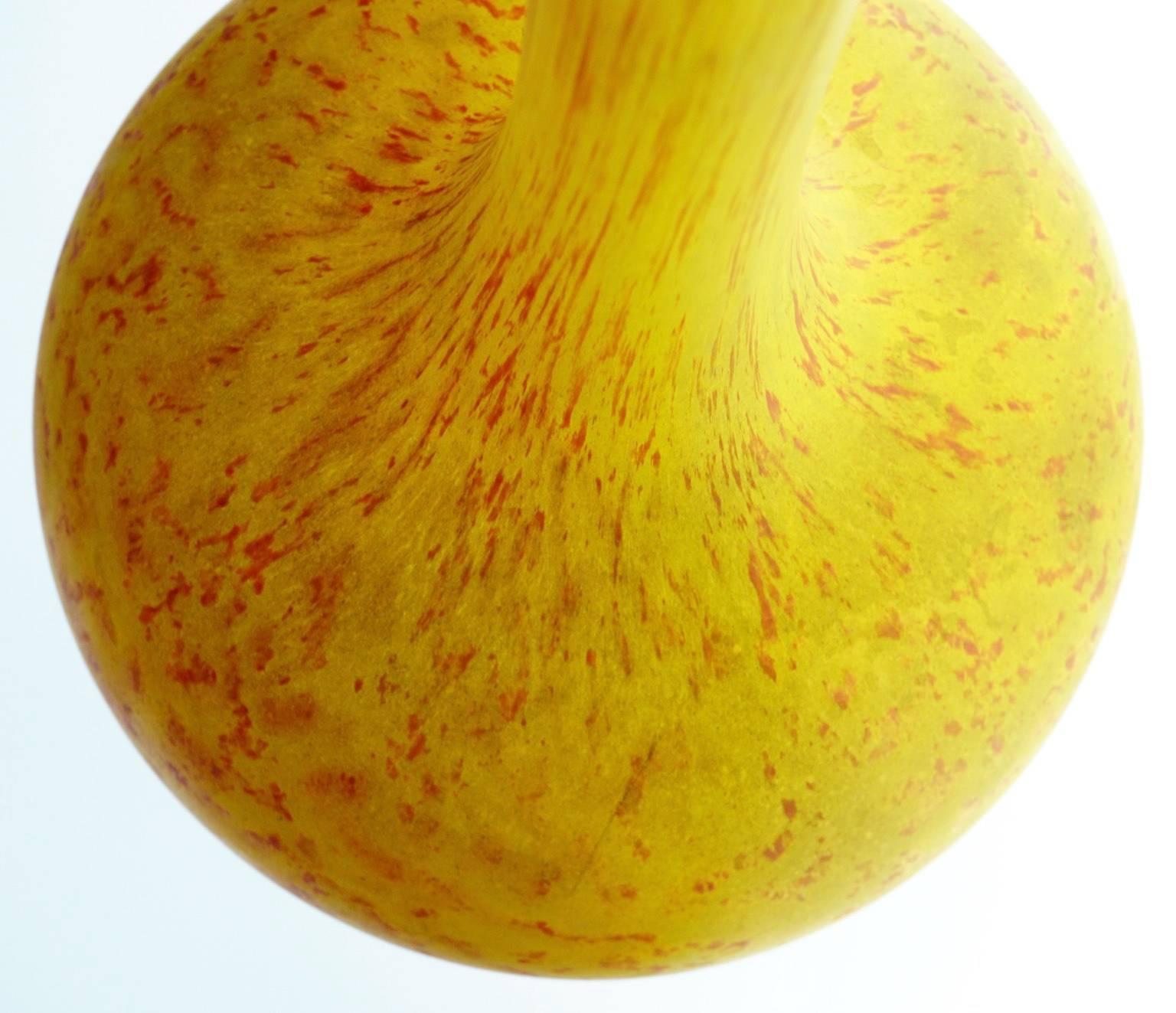 Large yellow berluze (long-necked vase in Persian shape). The signature, Delatte, is fairly worn.
The glass comes in yellow and orange fleckles due to vitrification with orange dust.