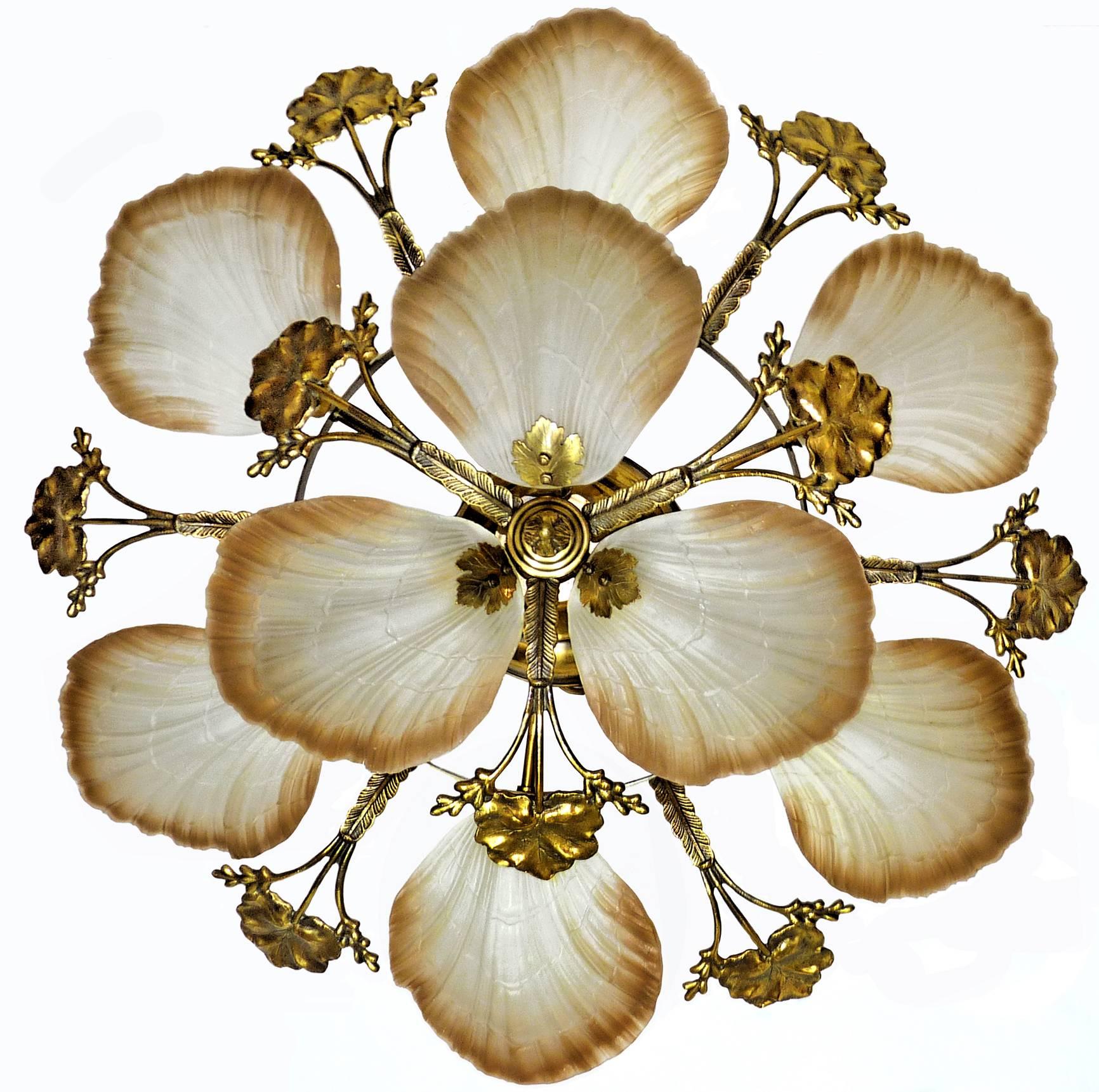 Art Nouveau style chandelier or flush mount with petal or shell shaped frosted glass and leaf design brass
Measures: 
Diameter 80 cm
Height 30 cm
Weight 12 Kg / 24 lb
Nine-light bulbs E14 Good working condition/European wiring.
Your item will