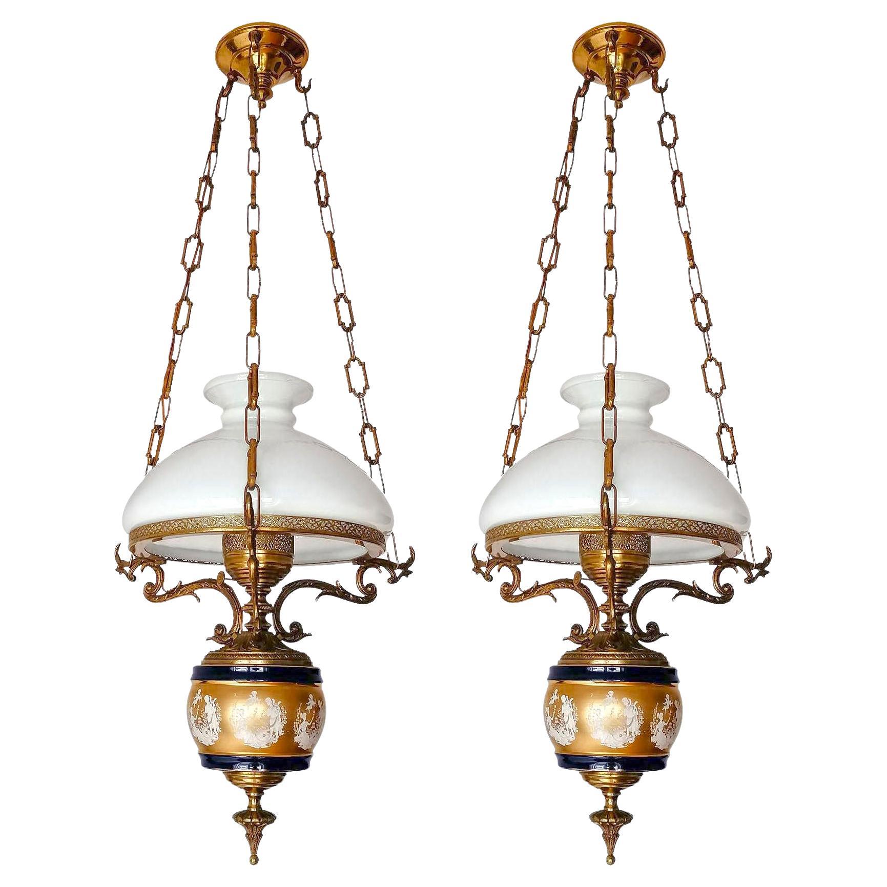 Gorgeous porcelain chandelier in gilt bronze Victorian library hanging oil lamp
and opaline glass shade. Also have a large matching chandelier. Price per unit. 

Materials: 
Opaline glass. 
Cobalt Blue & Gilt (Mate ad Bright Gold) porcelain 
Ornate