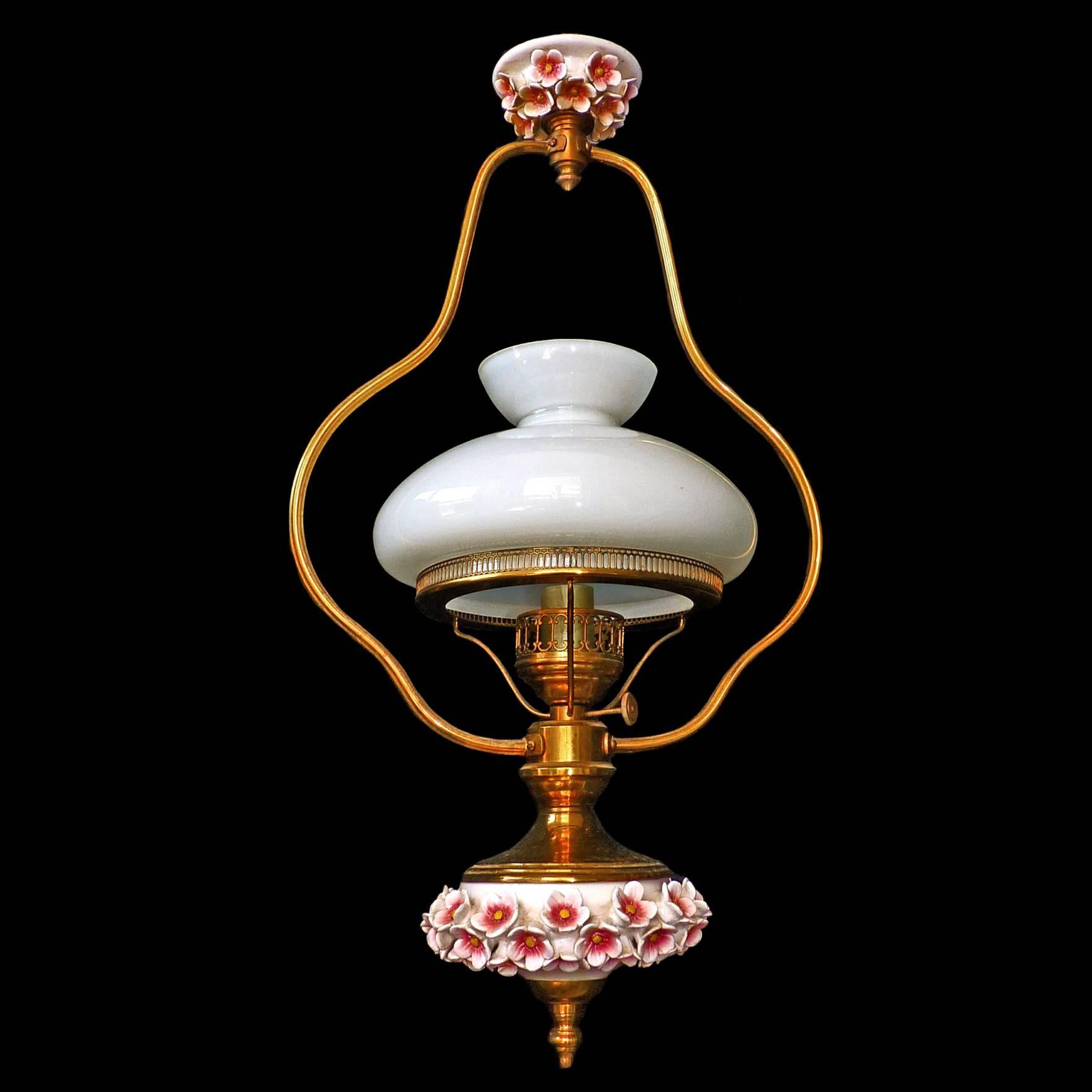 Adorable small antique 1950 Victorian hanging lamp French chandelier
With opaline glass shade and sculpted ceramic daisy applique porcelain.
Materials: Opaline glass/porcelain/ gilt metal
Measures:
Diameter: 12 in / 30 cm
Height: 40 in (25 in + 15