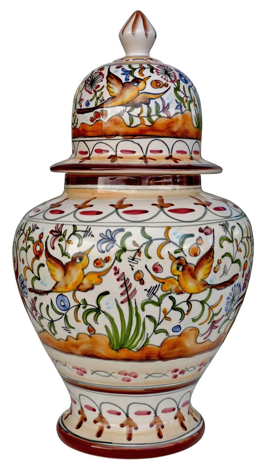 Delft polychrome Portuguese ceramic covered urn; hand-painted 17th century, tin glazed faience with floral, hunting and bird motif, early 20th century.
The intricacy of the hand-painted pattern is based on a typical Portuguese design from the 17th