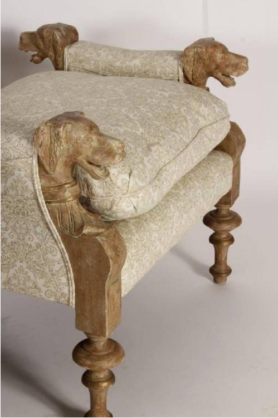 A fabulous set of two neo-classic style wood carved and upholstered dog head benches
Late 19th early 20th century.

Each bench is carved with fine detail and is partially polychromed and parcel-gilt, cotton damask patterned fabric, down cushions