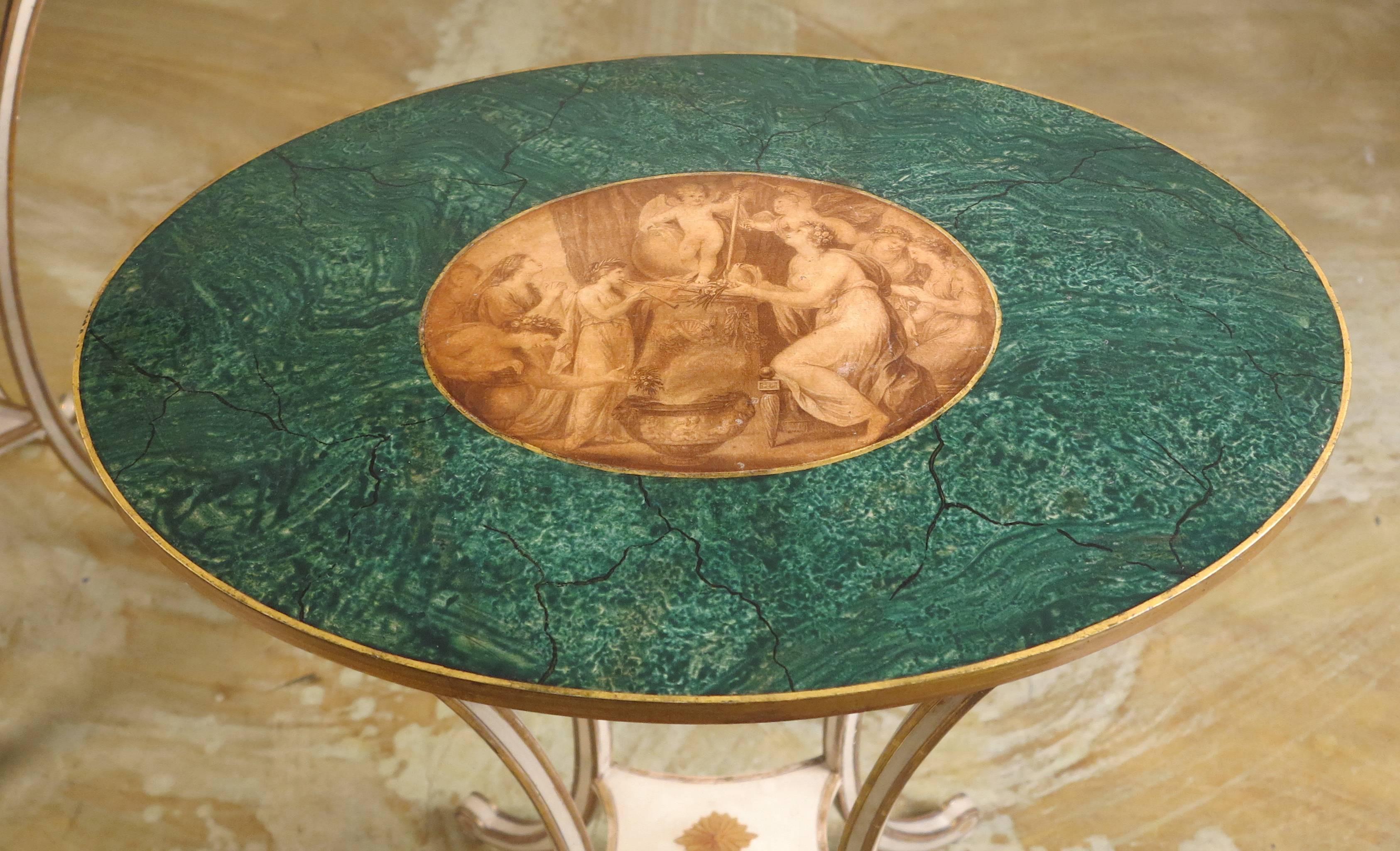 A fine pair of George III side tables
In Angelica Kauffman style
19th century

Each oval shaped top decorated with a central mythological painted scene surround with faux marbleized surface.
On four tapering shaped legs ending with a scrolled