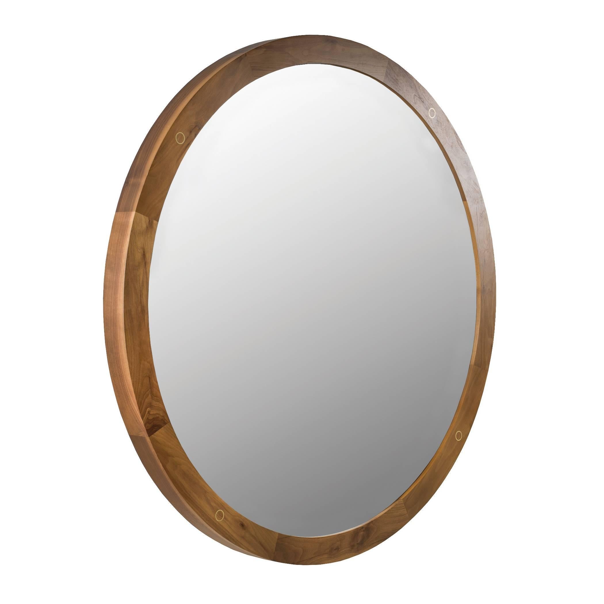 The Fulton mirror blends all natural American walnut with high grade hand-cut matte brass details.

Shown in natural walnut, clear mirror and matte brass. 
48 in diameter × 2.75 in depth.

**Each Desiron piece is handcrafted in the U.S.A.,