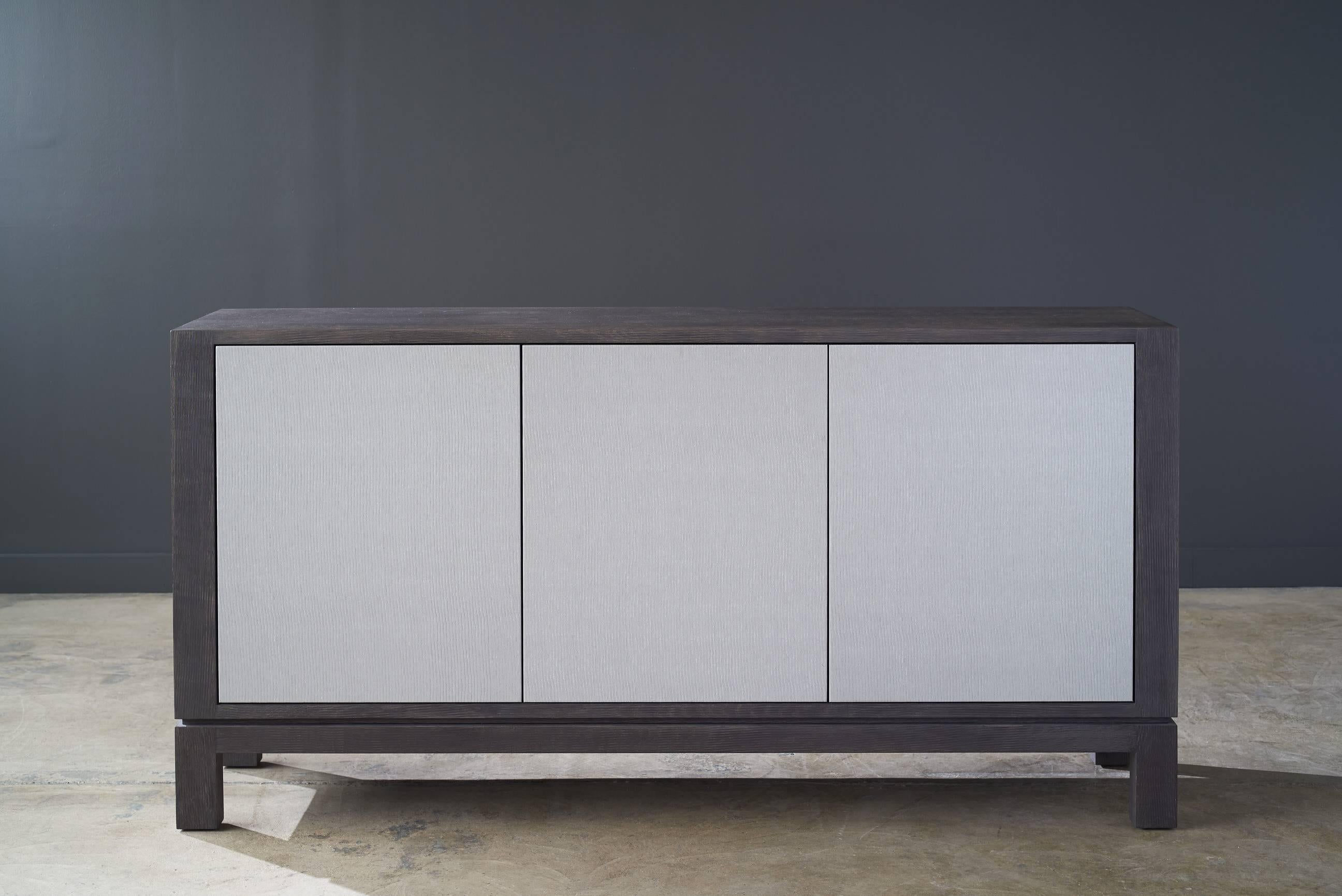 Elevate your home with the clean lines of our Madison sideboard. It is handcrafted with drift oak and wrapped with Innovations Taos Perla in sophisticated style.

Shown in drift oak and Innovations Taos Perla. Measures: 72in x 16in x 36in