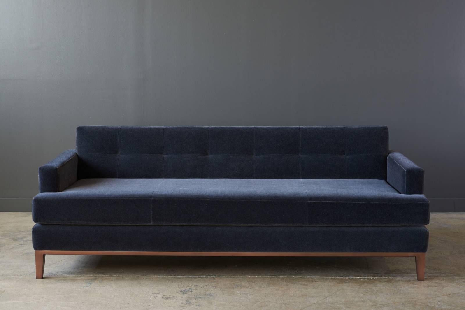 A fine modern designed sofa, the Sullivan sofa sits on a burnished copper base and upholstered in Maharam Mohair supreme slate 112.

Shown in burnished copper base and Maharam Mohair supreme slate 112.
Measure: 84 in x 35 in x 26.5 in H.

Each