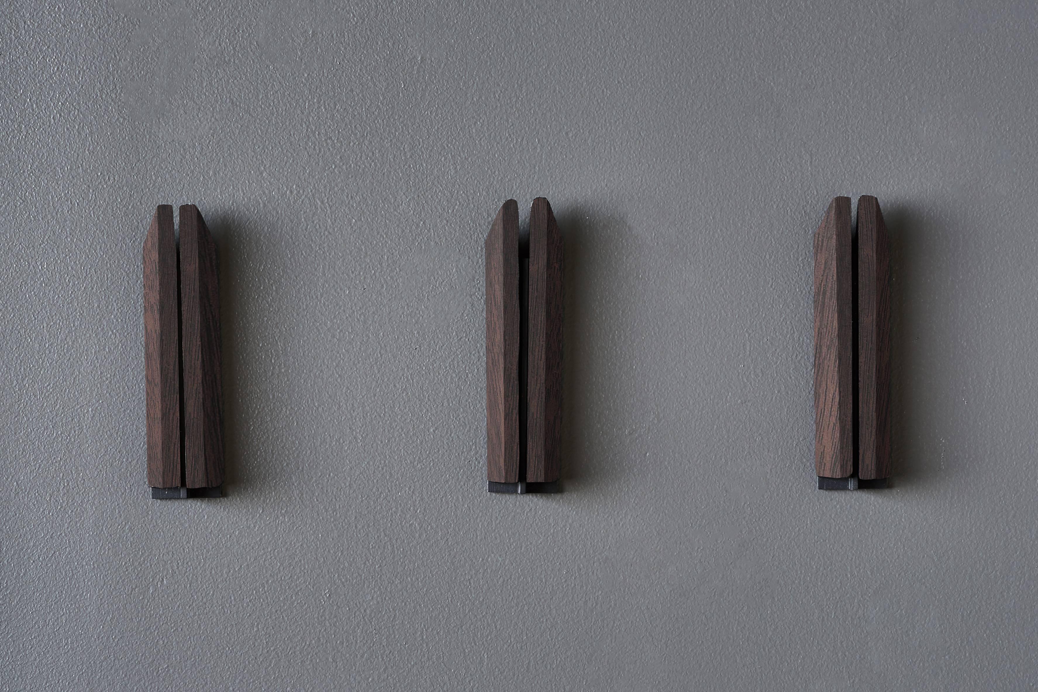 Individually handmade wall hooks in US sourced wood. (set of three)

Shown in Burnt Steel and Black Walnut.
1in x 1in x 6.25in H

Each Desiron piece is fully customizable and available in a variety of finishes.