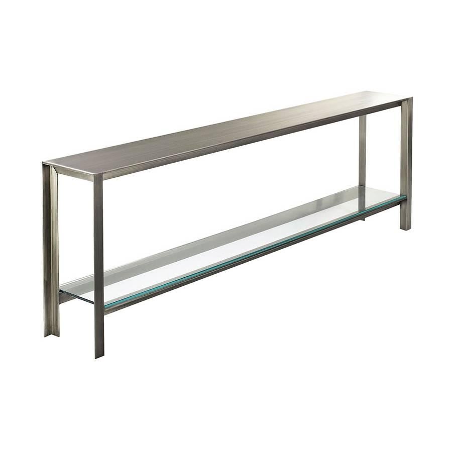 A sleek contemporary console, one of our best sellers, a combination of striking gunmetal paired with hand-cut glass.

Available and shown in gunmetal and clear glass. Also shown in Distressed Brass and Bronze Glass.
72in × 10in × 30in
