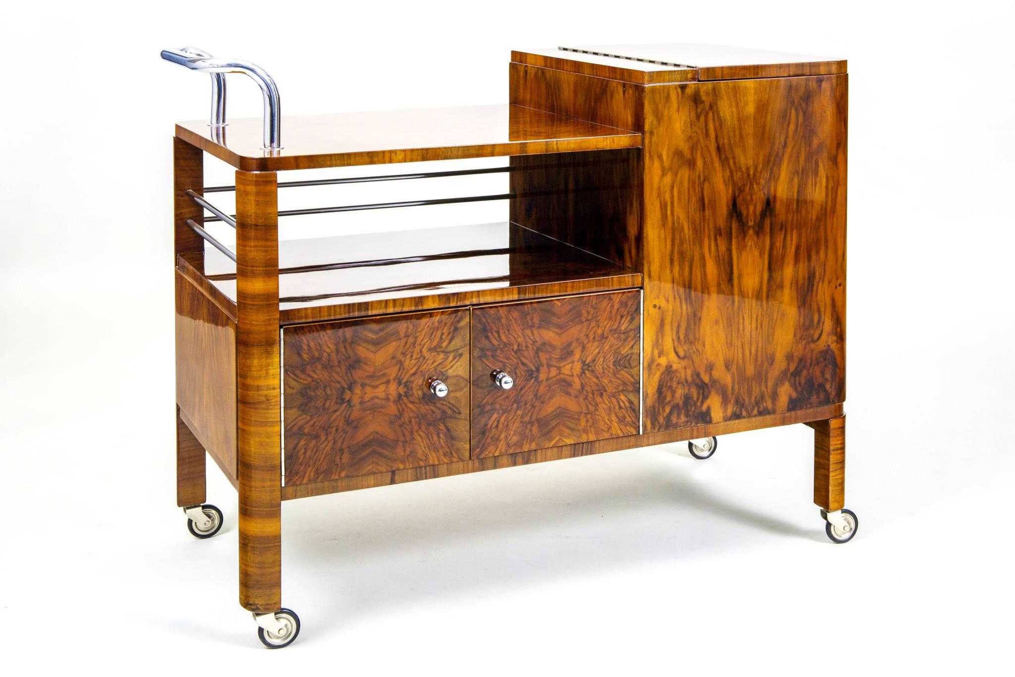 Art Deco serving trolley by Thonet 
Completely restored. 
Surface was made by piano lacquers to the high gloss. 
Walnut veneer.