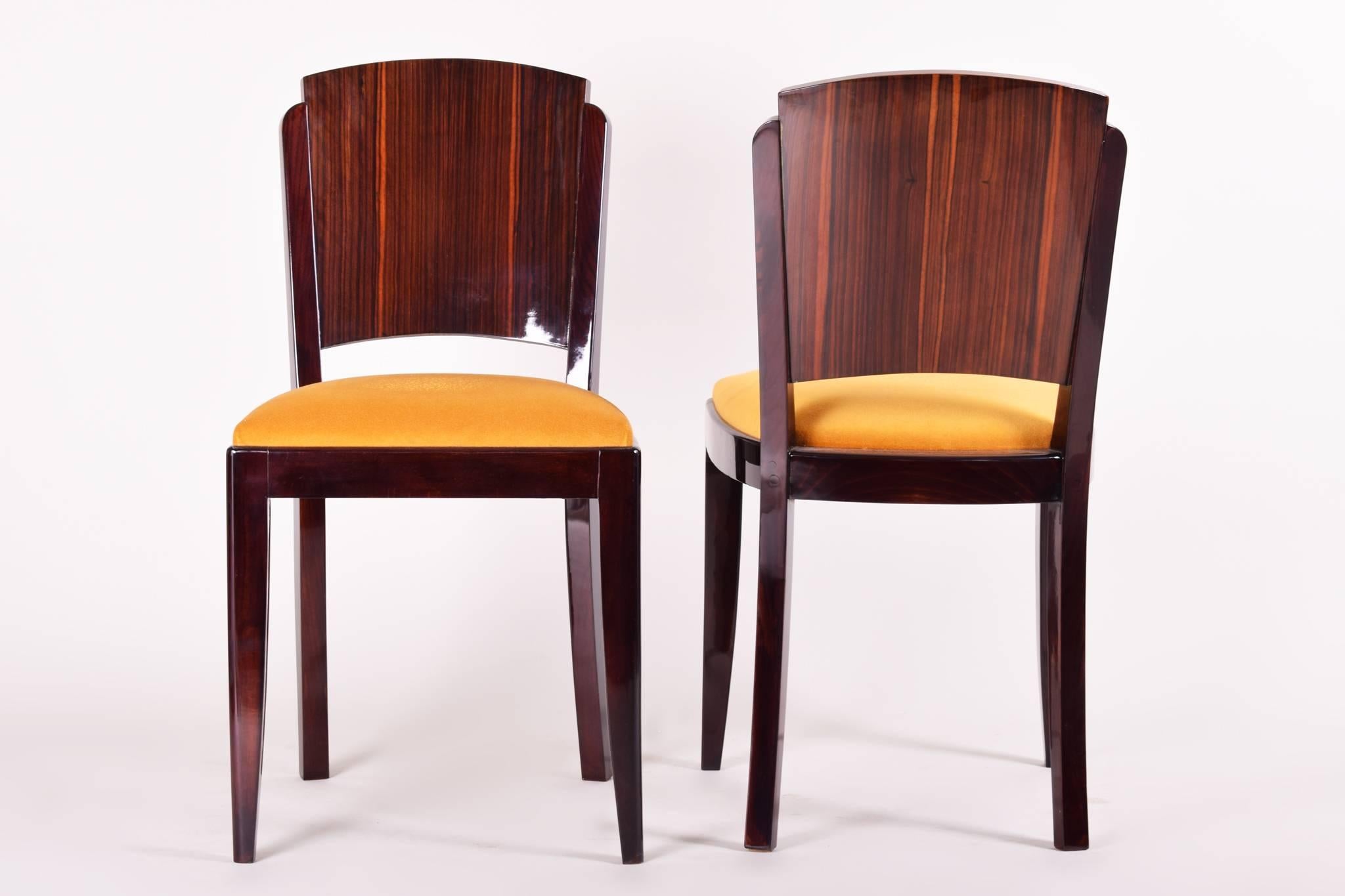 French set of chairs, six pieces designed by French architect Jules Leleu. 
Style: Art Deco.
Period: 1920-1929. 
Material: Macassar. 
Completely restored. Surface made by piano lacquers to the high gloss.

We guarantee safe a the cheapest air