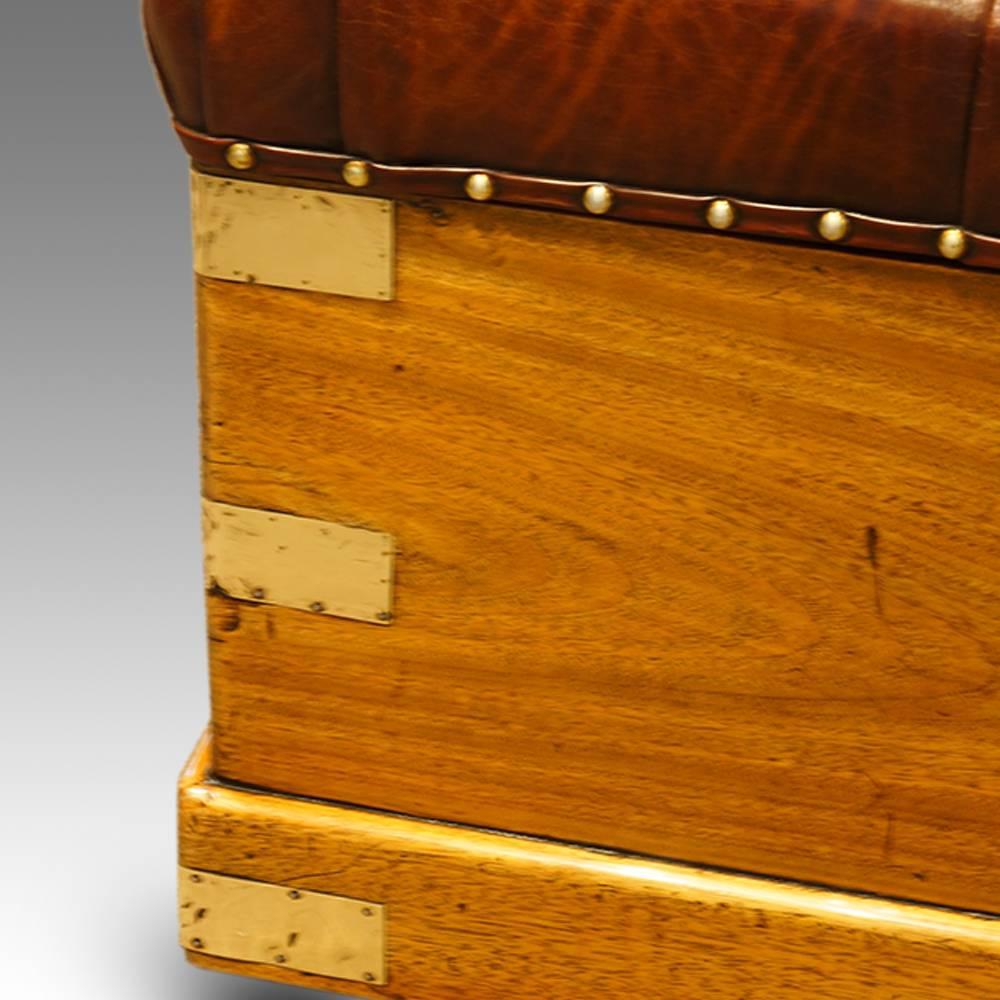 Victorian camphorwood and leather ottoman trunk.
Here we have this wonderful and very useful camphorwood chest.
The buttoned antiqued leather lid that lifts with a brass loop handle to reveal a large storage space.
The body with large brass strap