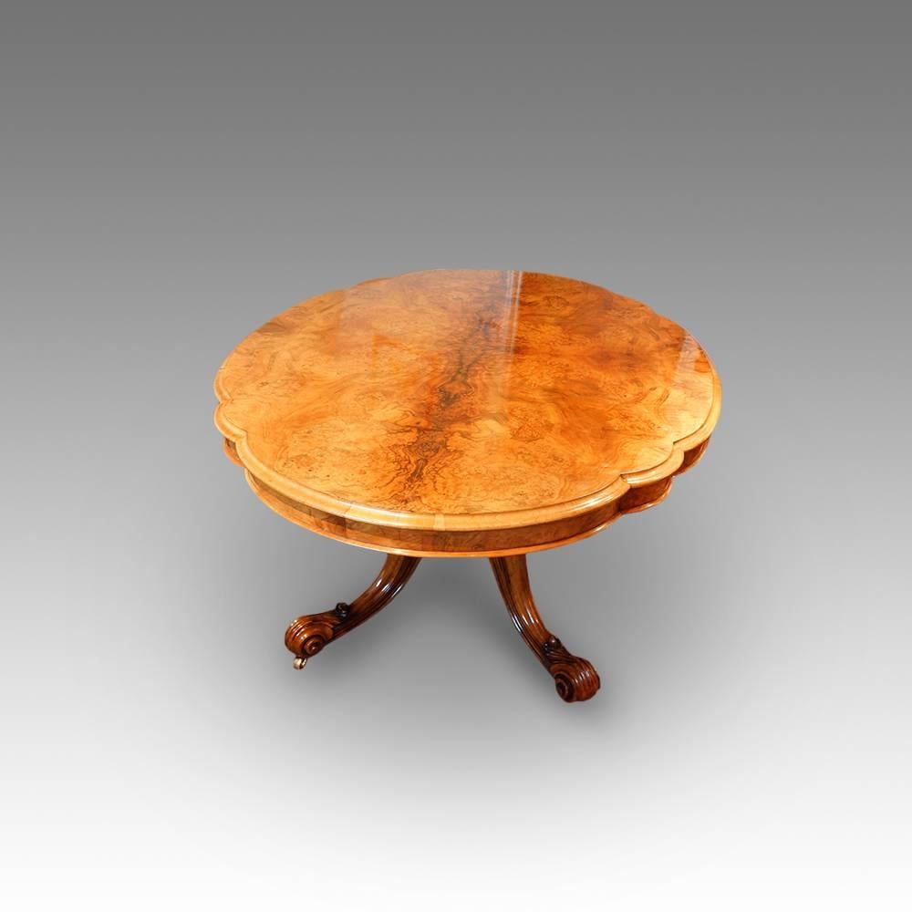 Victorian walnut shaped loo table.
The Cathedral close table.
Here we have this magnificent Victorian walnut loo table in burr walnut.
The shaped top with moulded end grain walnut, that stands on a solid walnut turned column with four cabriole