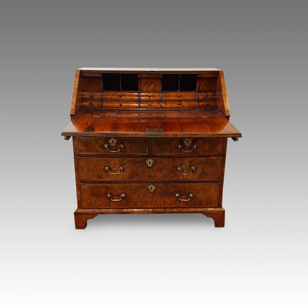 18th century walnut bureau
Here we have this walnut bureau, made in the early part of the 18th century veneered in fine burr walnut to the fall front and also the drawers, and with figured and straight grain walnut to the sides.
This particular