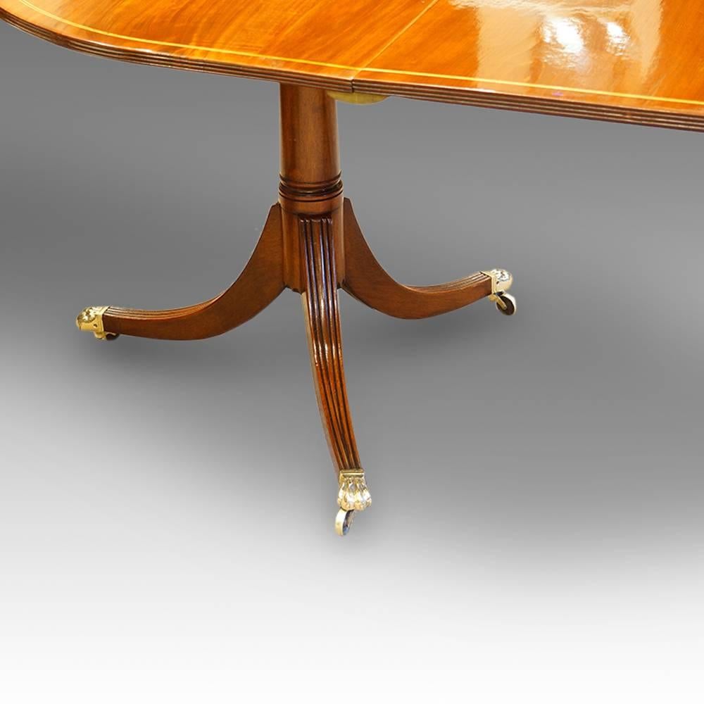 Mahogany twin pillar dining table, 1930s
Here we have this solid mahogany dining table, supported by twin pillar supports. The pillars are tripod bases, with fine moulded reed splay legs finished with brass cap castors, sweeping off the central gun
