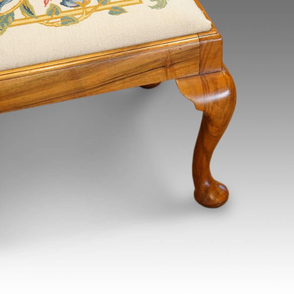 Walnut 1920’s double fender foot stool
This walnut foot stool has a drop in seat, with a embroidered seat. As it has a drop in seat, it would be easy to have this re upholstered to your own requirements.
The footstool stands on 6 cabriole legs