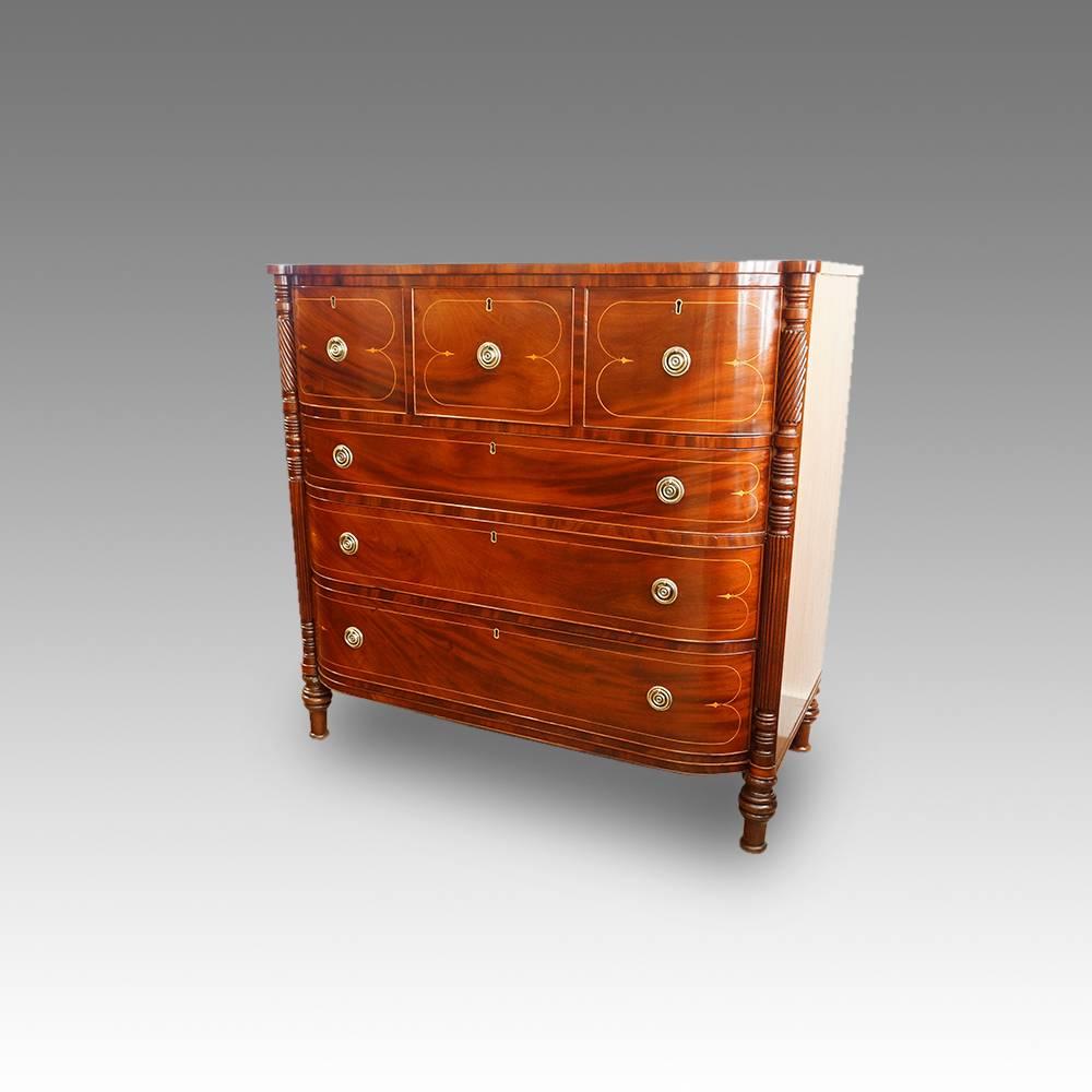 Regency inlaid mahogany chest of drawers of D-shape
This Regency inlaid mahogany chest of drawers is of a D-shape.
Having half columns of rope twist and reeds to each side of the drawers. The rope twist was very popular in the early part
