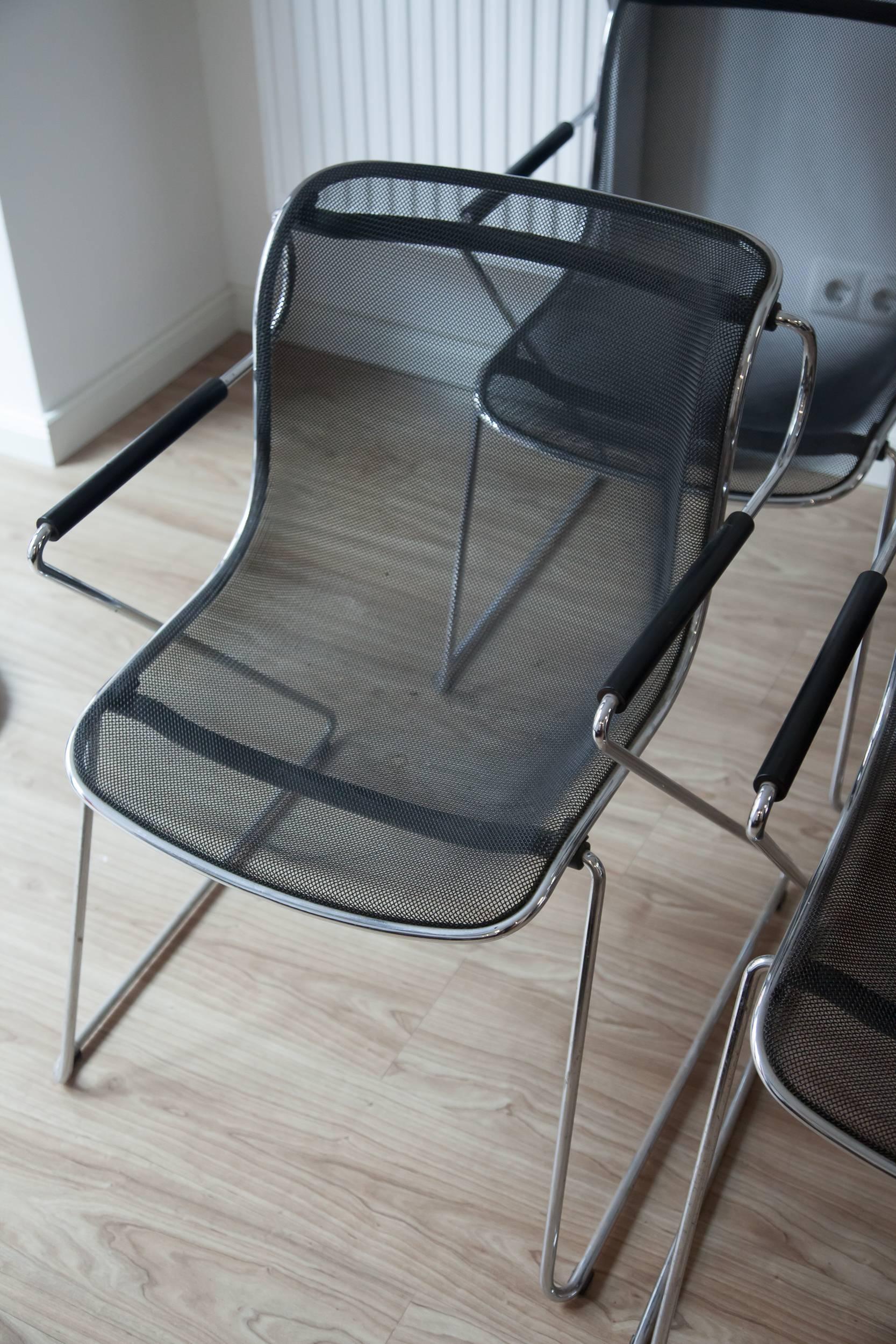 A set of six ergonomic stacking chairs designed by Charles Pollock (brother of Jackson Pollock) for Anonima Castelli (Italy). They have a metal frame with formed mesh seats and backs. Measure: Each chair weighs 8 kg.