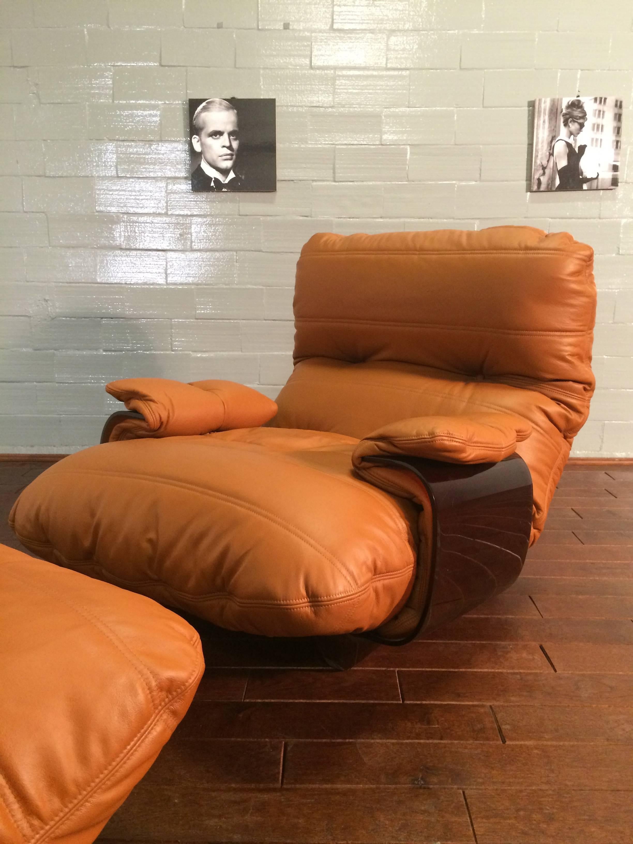 This Marsala lounge chair and pouf were designed by Michel Ducaroy in the 1960s and were manufactured by Ligne Roset in France during the 1970s. They have been reupholstered in genuine cognac leather and each feature the original Ligne Roset logo.
