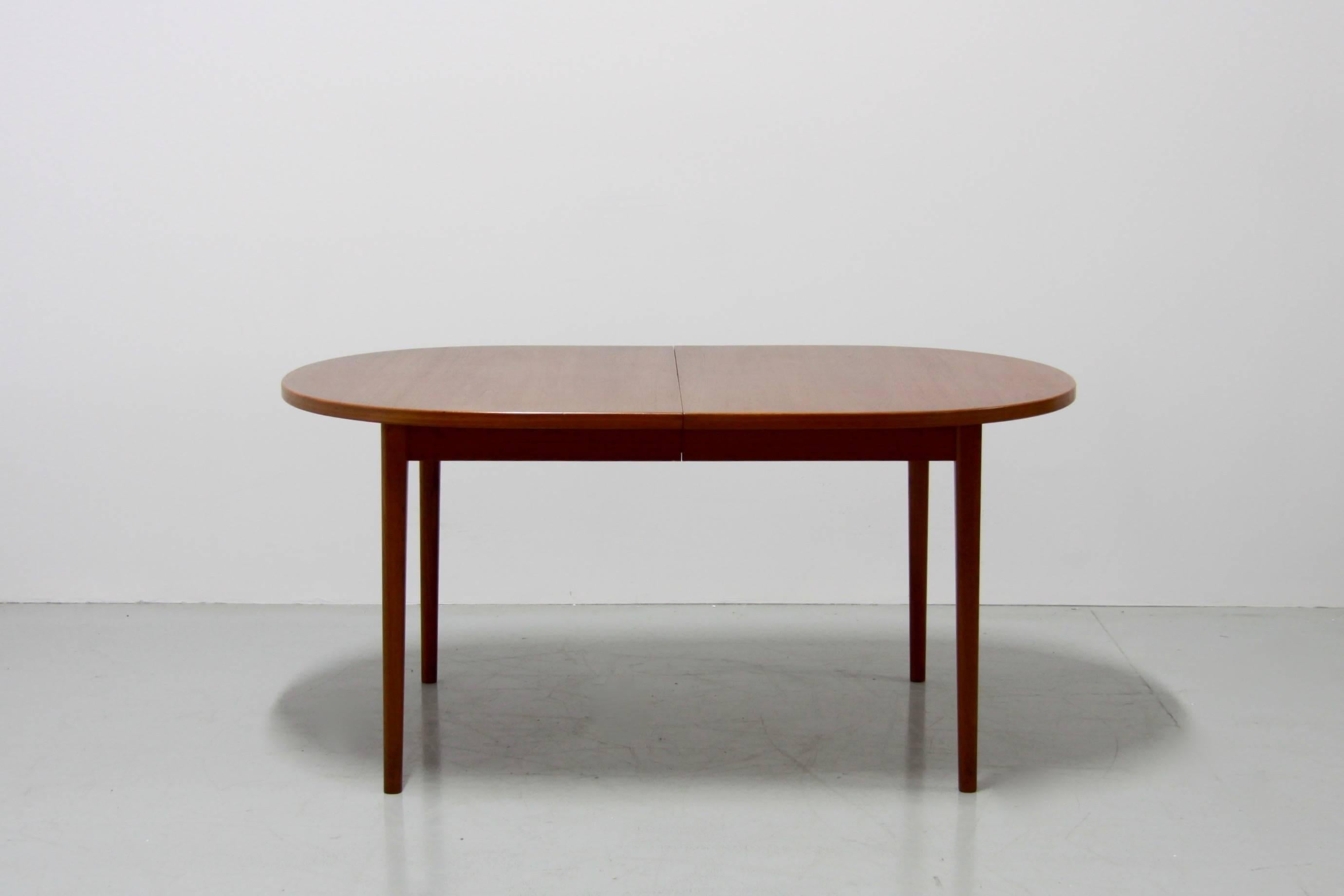 This table was created by Nils Jonsson for Troeds, Sweden in the 1960s. It is a minimalist design with clean lines. The table seats up to six dining chairs but with the addition of two generous extensions which are stored within the table and can be