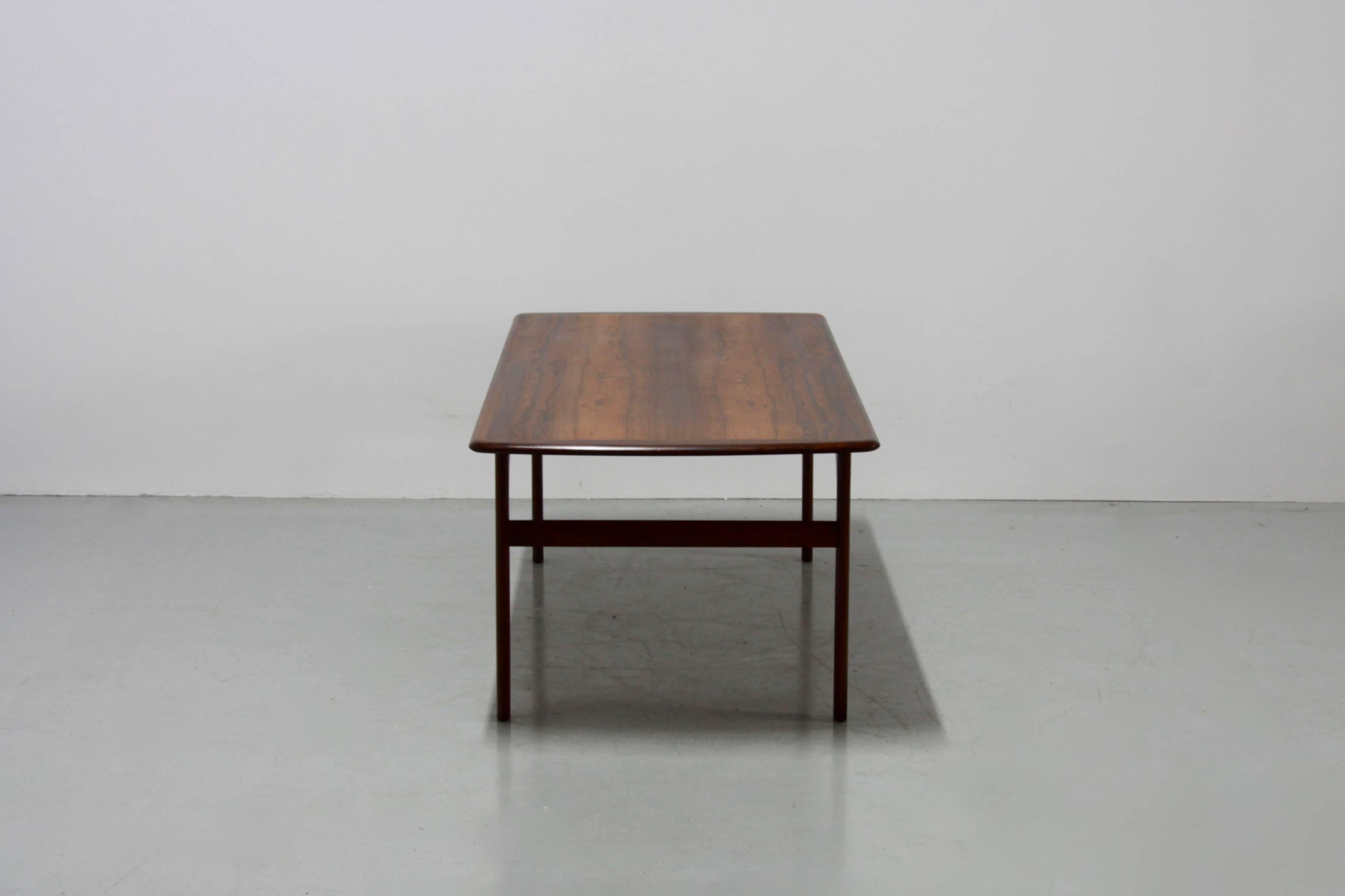 This beautiful coffee table is made from teak in 1960s. It has a beautiful texture and a stunning deep brown color.