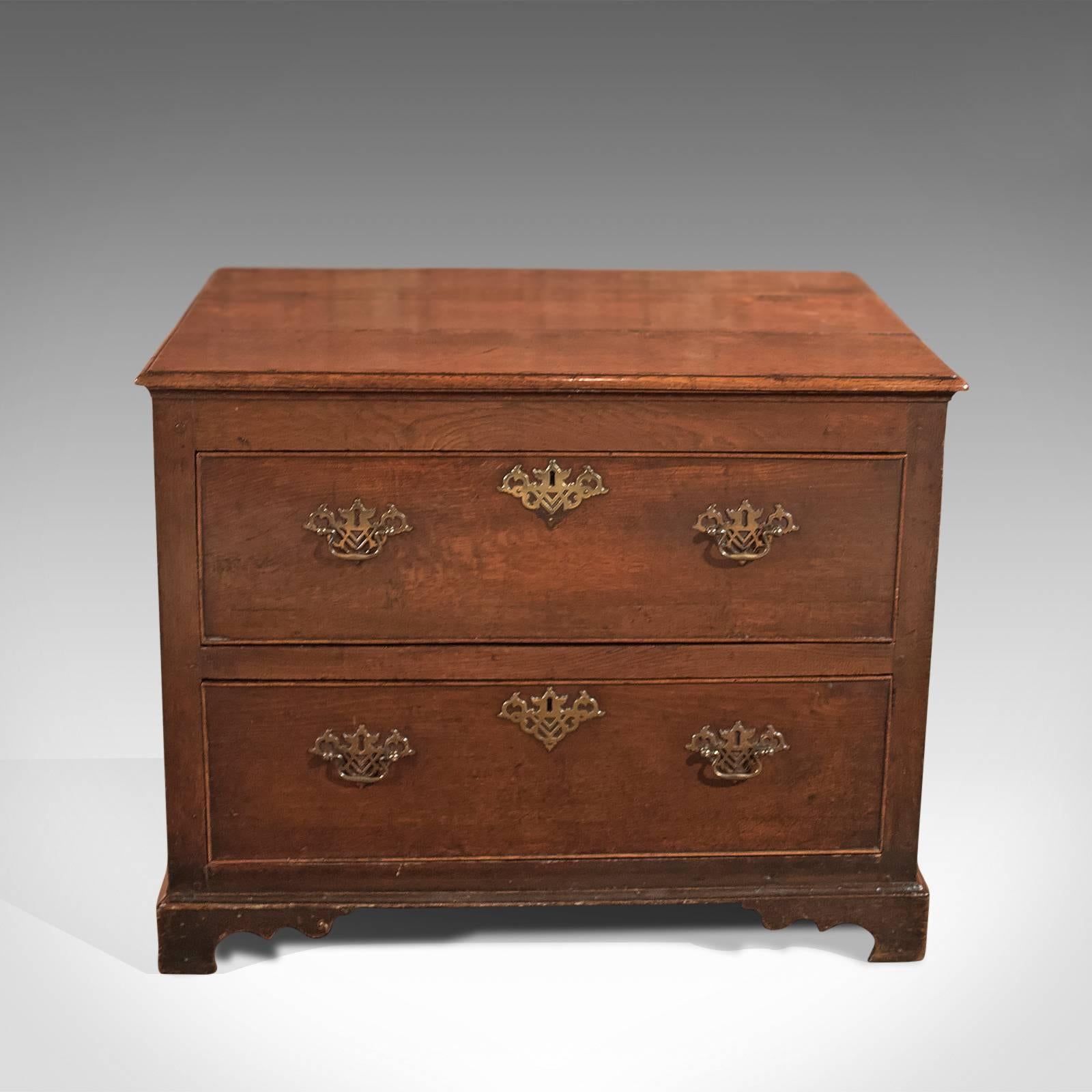 This is a well-proportioned Georgian, antique squat tall boy, chest of drawers dating to circa 1750.

English oak with good colour and grain interest
Three plank top with moulded edge
Raised on typical shaped bracket feet
Field panel sides and