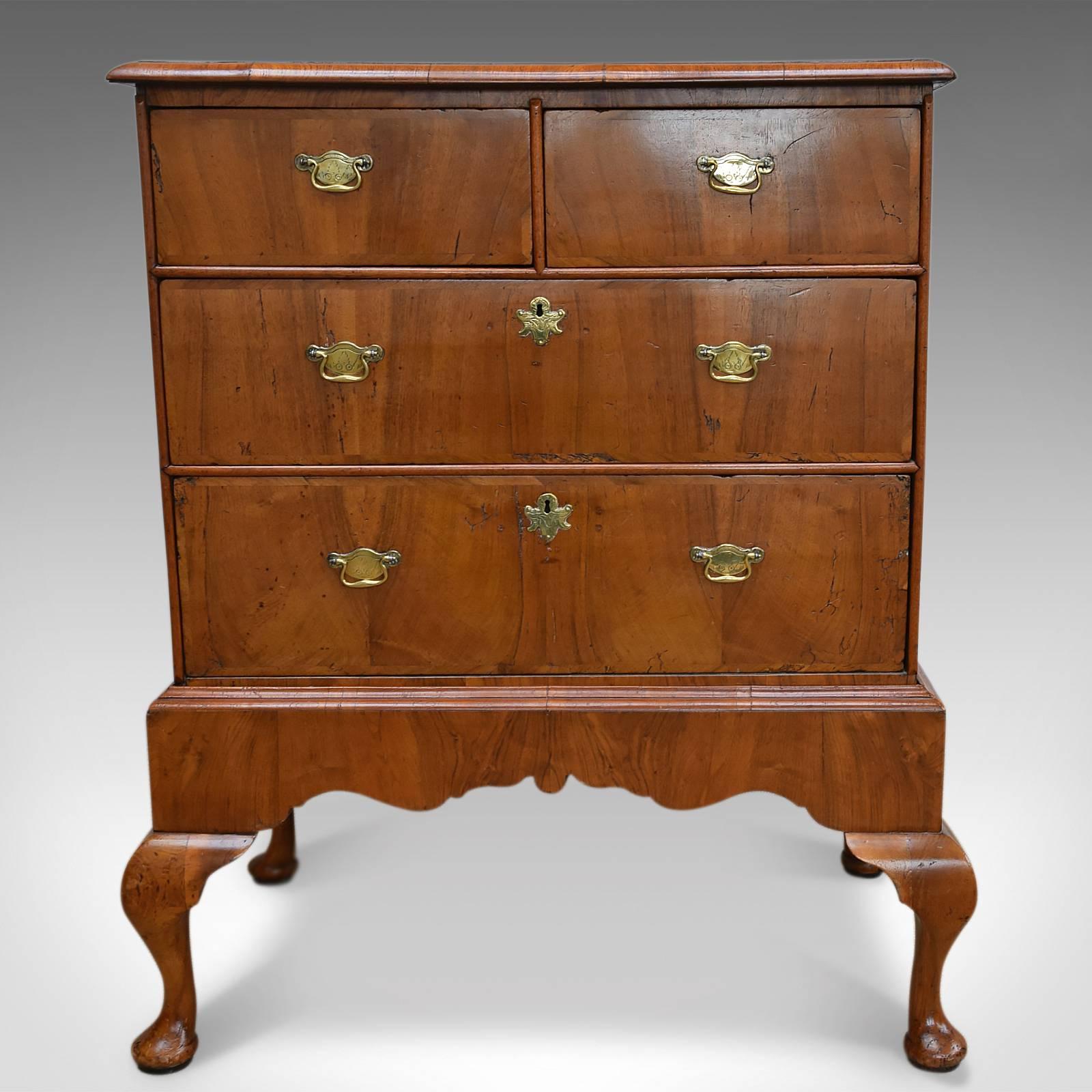 This is an antique chest on stand dating to the early Georgian period, circa 1720.

Rare to find with a desirable aged patina
Burr walnut top with grain interest
Double cross banded with edge moulding
Two over two drawer configuration
Walnut