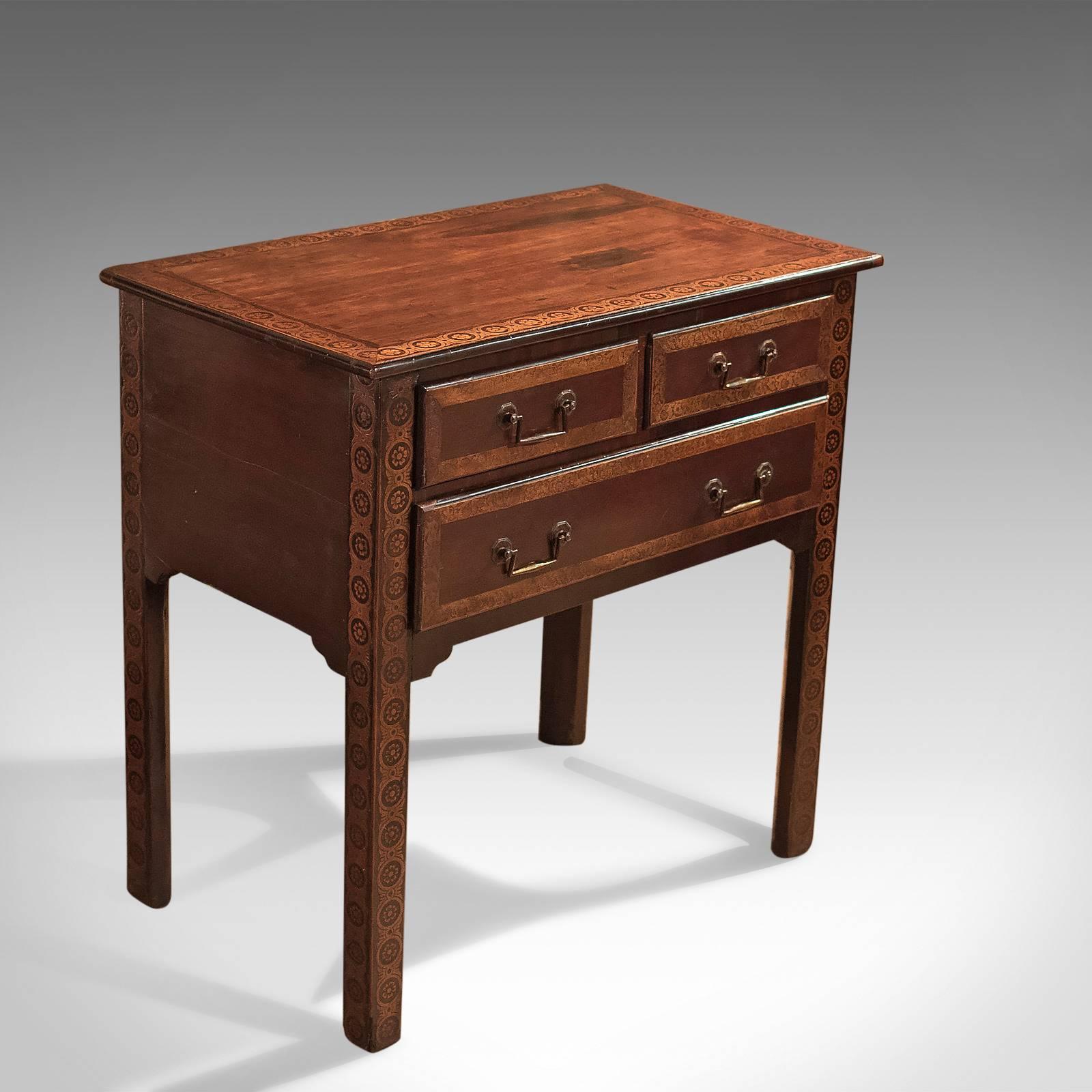 This is an appealing antique lowboy dating to the early 18th century, circa 1720.

Mahogany with an aged patina and contrasting decoration
Raised on stout, straight square section legs with chamfered inner corners
Legs and top decorated with
