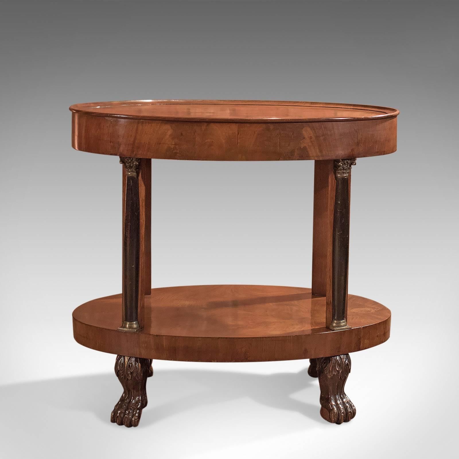 This is a super example of a French antique side table, or gueridon, in the cross-over from Directorie to Empire styles of the early 19th century, circa 1815.

Choice cuts of mahogany displaying good colour and grain detail
Ovular in form with
