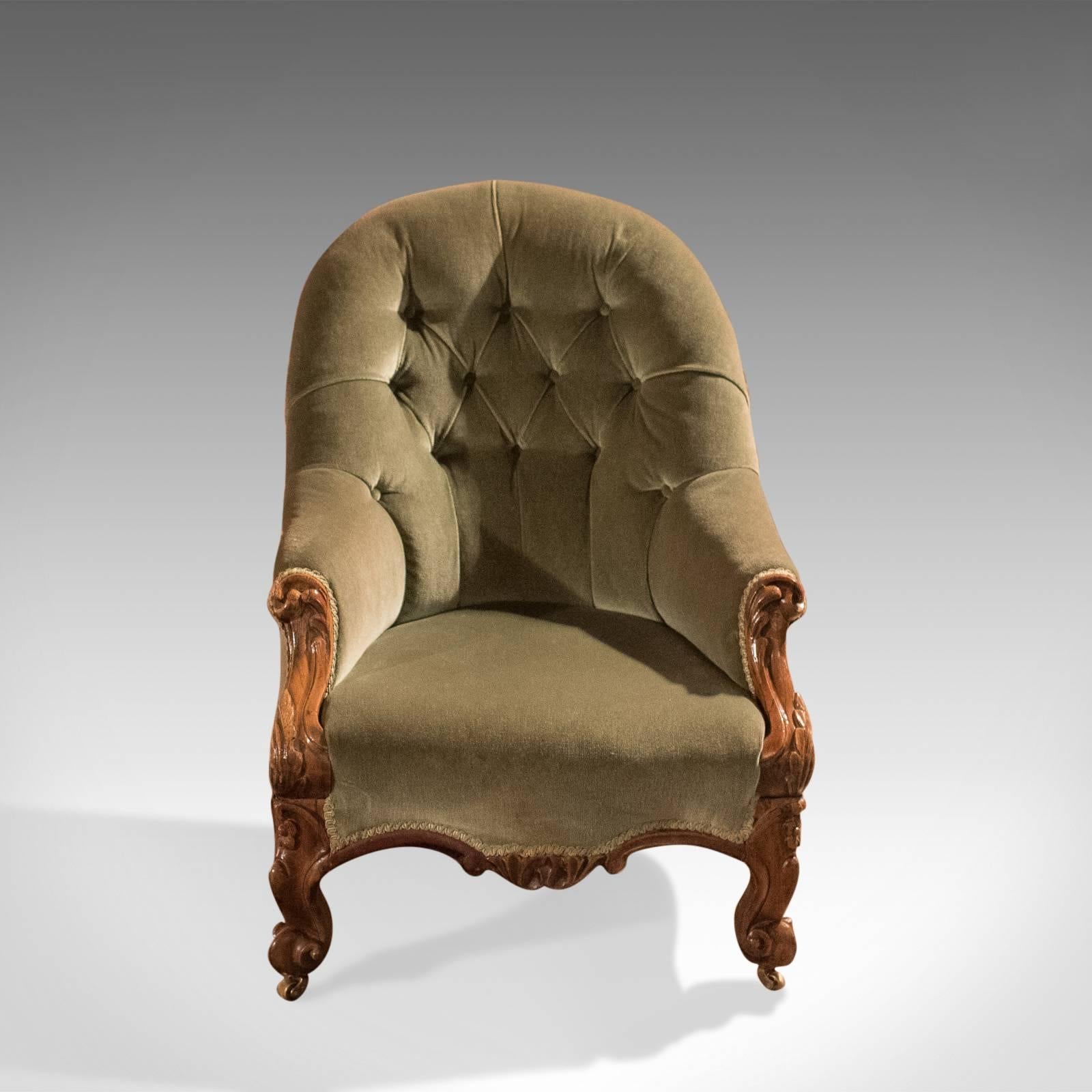 This is an early Victorian, button-back, antique salon chair offering a comfortable seat and dating to circa 1840.

Superior build quality in English walnut
Raised on stout, splayed cabriole legs
Good quality carving with acanthus leaf knees and