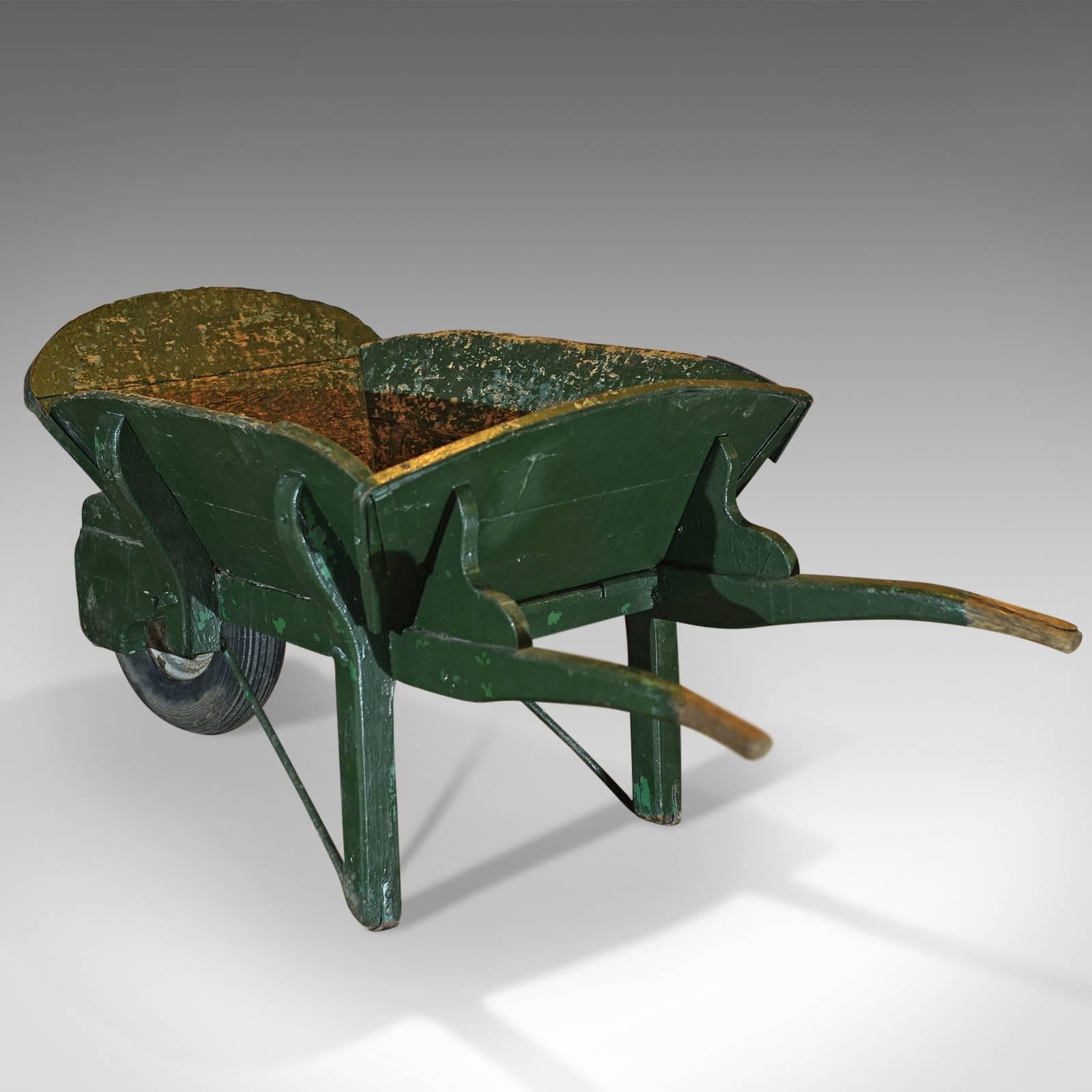 wrought iron wheelbarrow planter