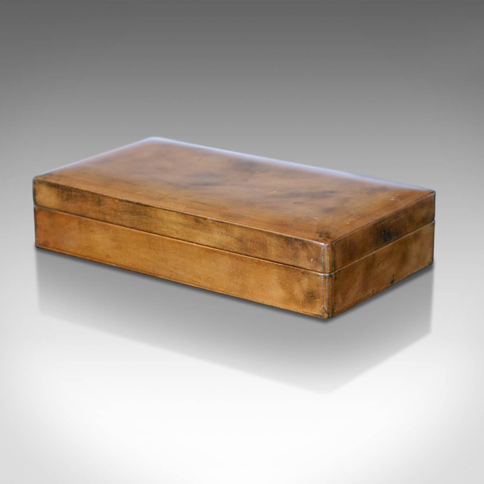 This is a Mid-Century leather card box.

Beautifully crafted with a tanned, aged patina this card case is exceptionally well made and perfect for a variety of small storage purposes or just simply for display.

Made in Italy for the famous store