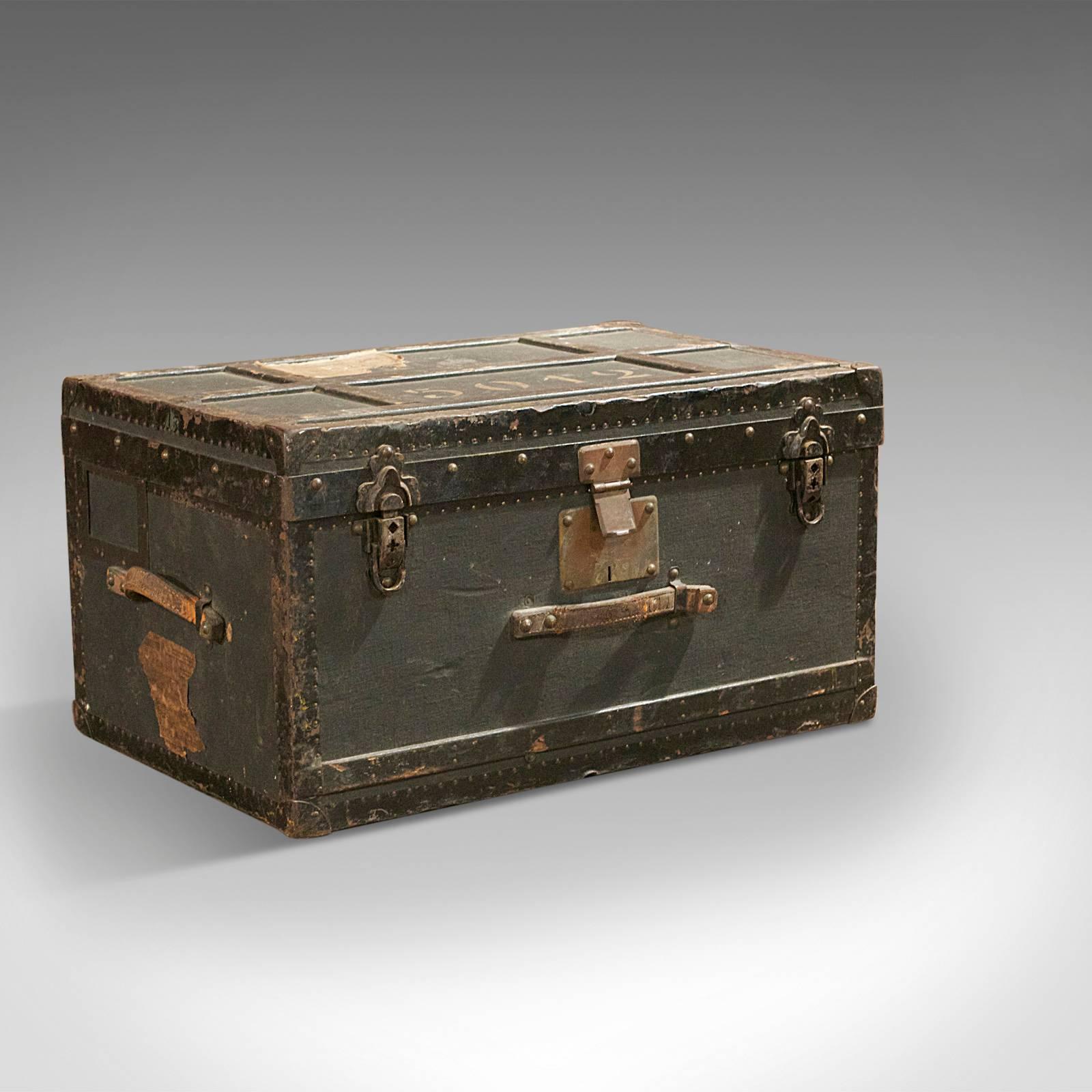 This is an antique Swiss military officer's trunk dating to the early 20th century.

Featuring original labels including the packing sheet inside the lid, this metal bound officer's trunk is triple hinged with the original clasps closing it