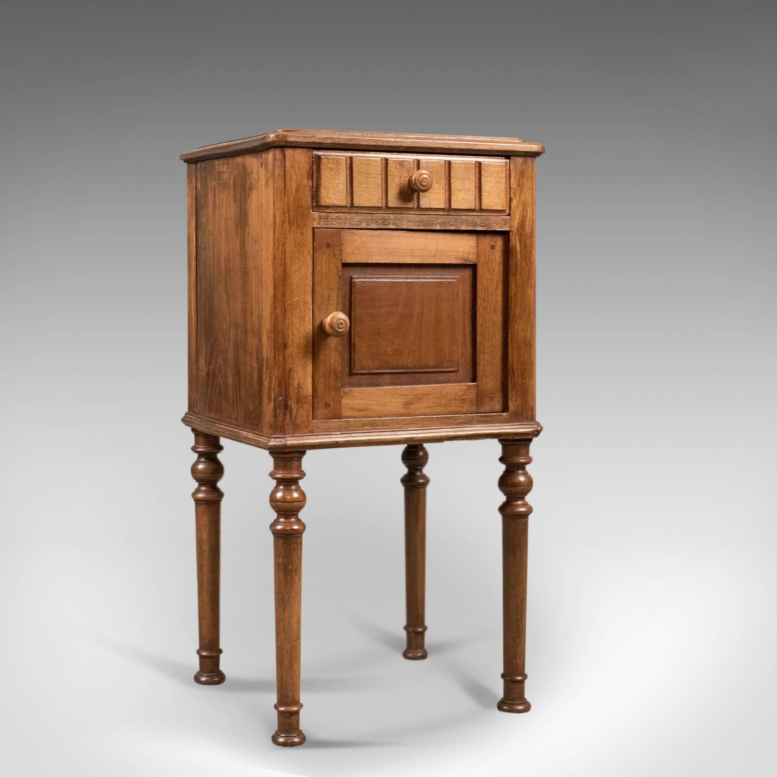 This is an appealing antique bedside cabinet, Victorian pot cupboard dating to the turn of the century, circa 1900.

English elm with attractive honey tones and an aged patina
The top double displaying good grain detail and double edge