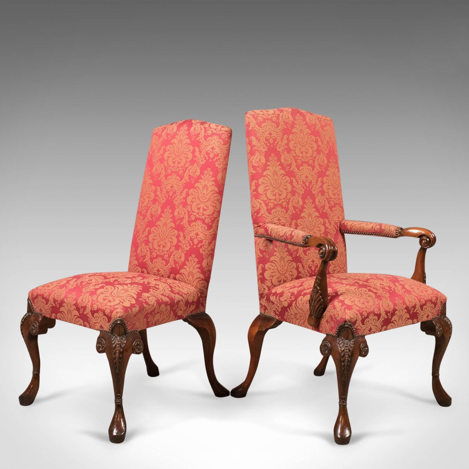 This is an exceptional set of ten upholstered dining chairs in the early 18th century manner.

A pair of carvers and eight standard chairs
Superior quality craftsmanship and finish
Raked back panels for comfort with gently rounded crest