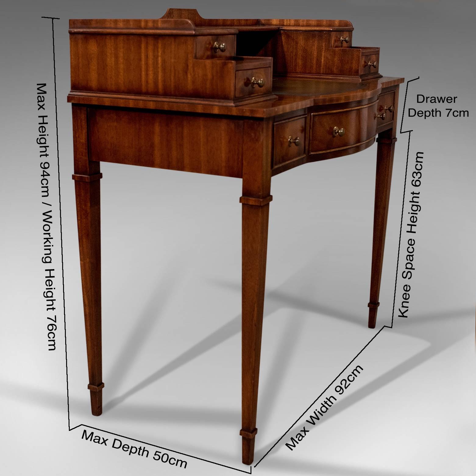 This is a writing desk in the antique Sheraton taste, a mahogany leather top table bureau dating to the late 20th century.

A most pleasing mahogany writing desk bureau presented in very good condition
Of classic Sheraton form offering effortless