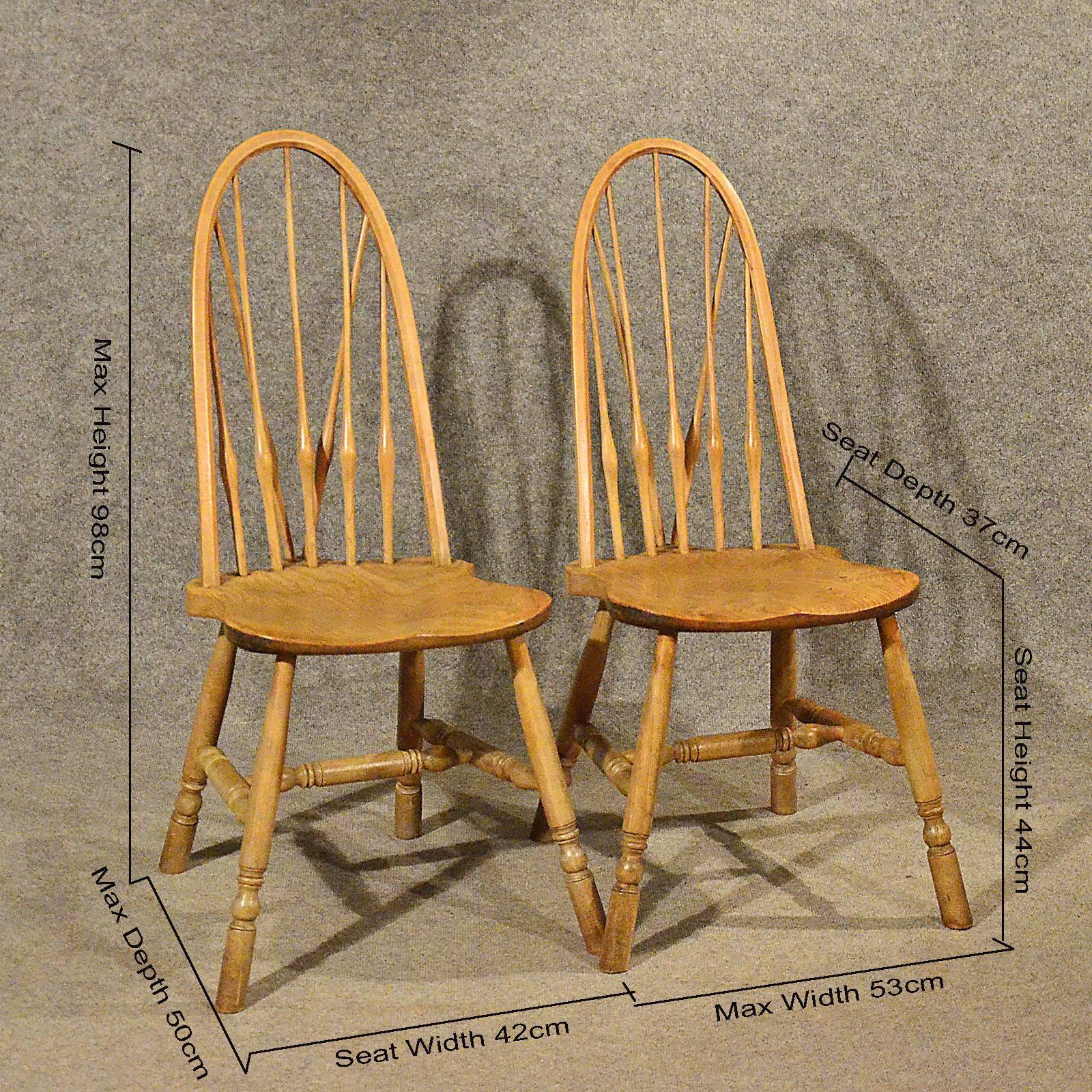 A superior pair of antique chairs presented in very good condition
Arts & Crafts styling
In elm with pleasing color and grain
Desirable seat form offering comfortable seating
Rising from turned legs united by a turned H-stretcher for