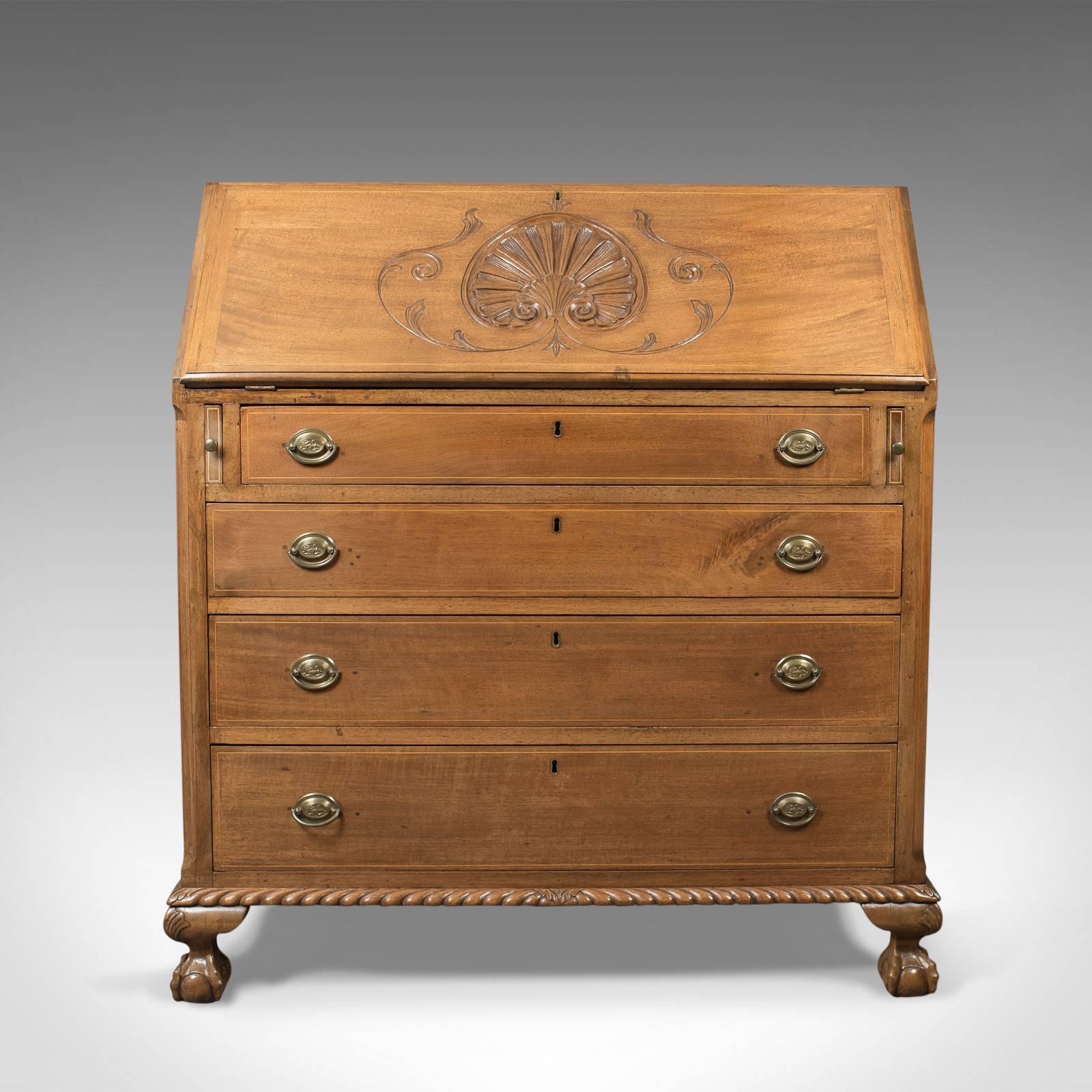 This is a handsome antique bureau, a Victorian walnut desk, English, circa 1900.

Attractive pale walnut displaying exposed dovetails to the top
Raised on squat cabriole legs with carved knees and talon and ball feet
Roped lower moulding, canted