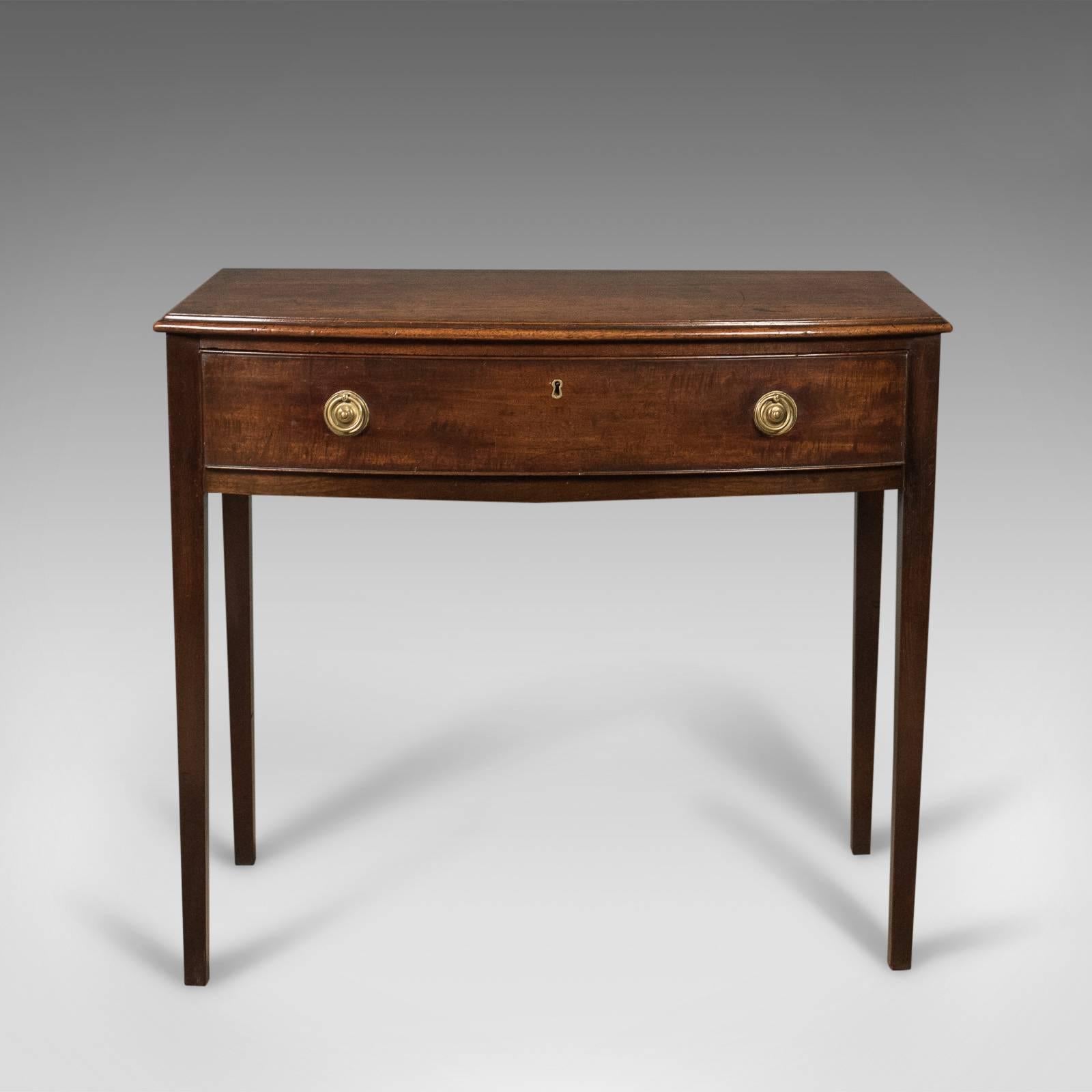 This is an appealing antique side table in mahogany, bow fronted, English and dating to the reign of George III, circa 1770.

Displaying good proportions in an elegant, Classic design
Mahogany showing consistent color, grain interest and a