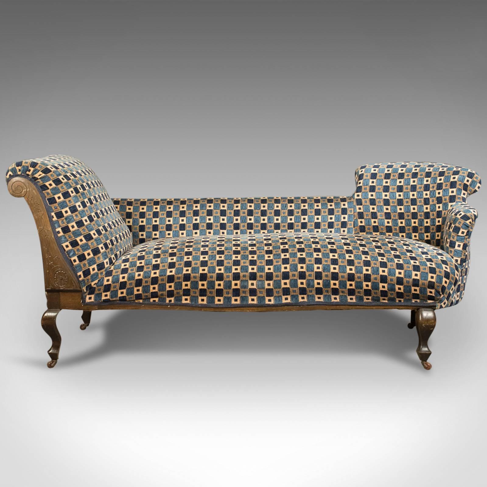 This is a good quality antique chaise longue, an Edwardian daybed, English dating to circa 1910.

Double ended sofa daybed presented in fine order
Raked and scrolled one end with chair back and arm opposing
Well sprung and professionally