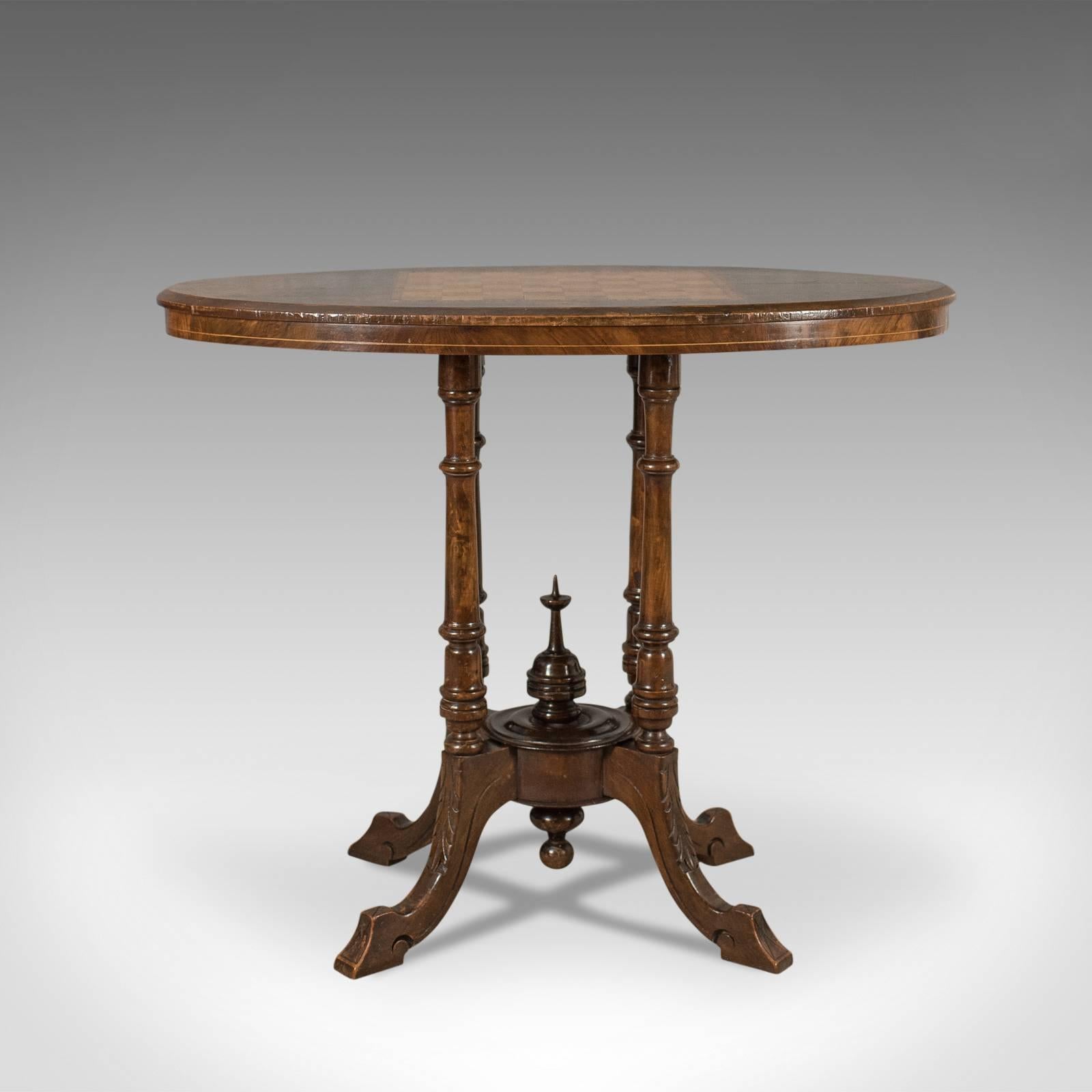 This is a delightful Victorian antique side table with inlaid chess board, an English piece dating to circa 1880.

English walnut displaying desirable swirly grain in a polished finish
Good color in the butterscotch hues beneath a wax polished
